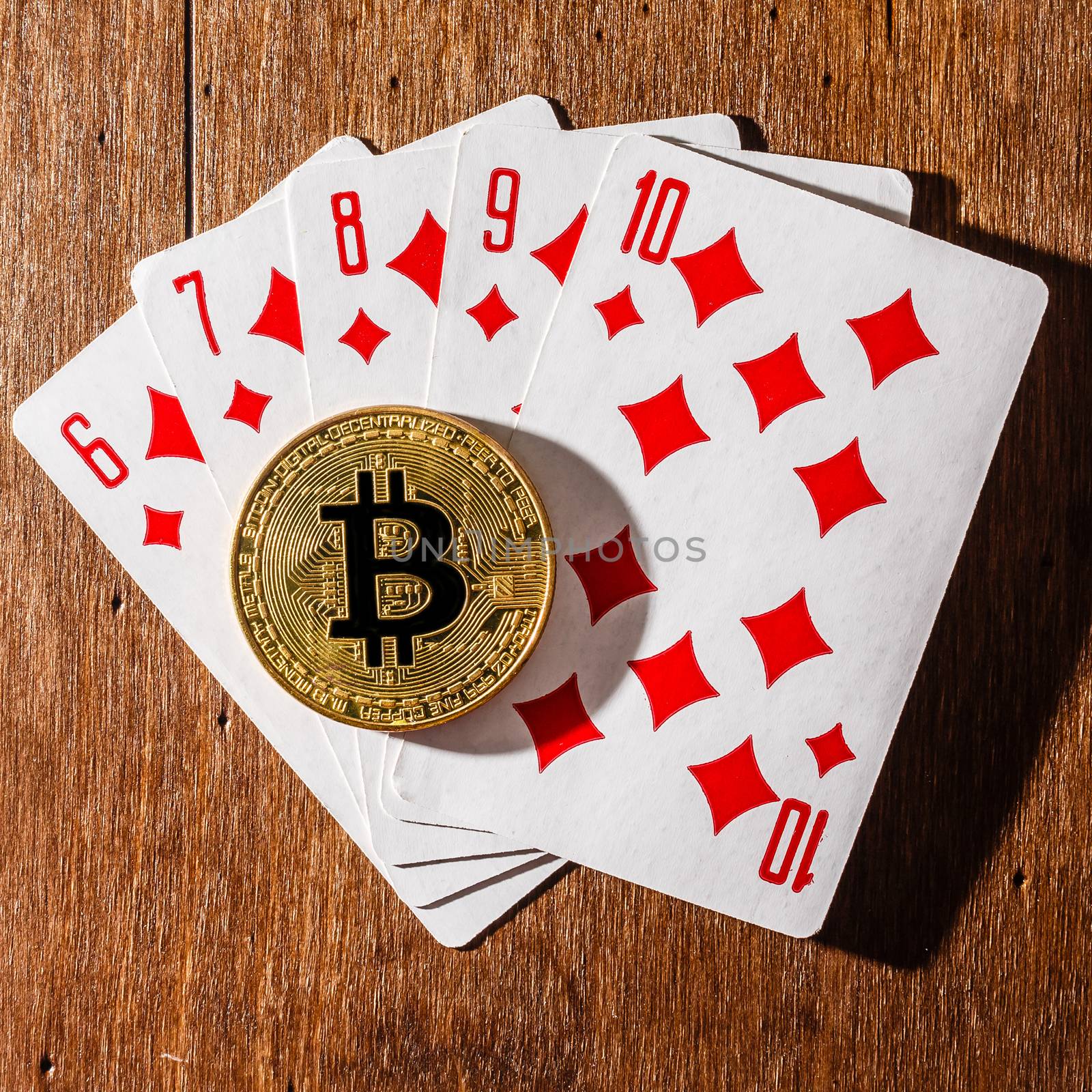 Bitcoin coin, cards and dices on table