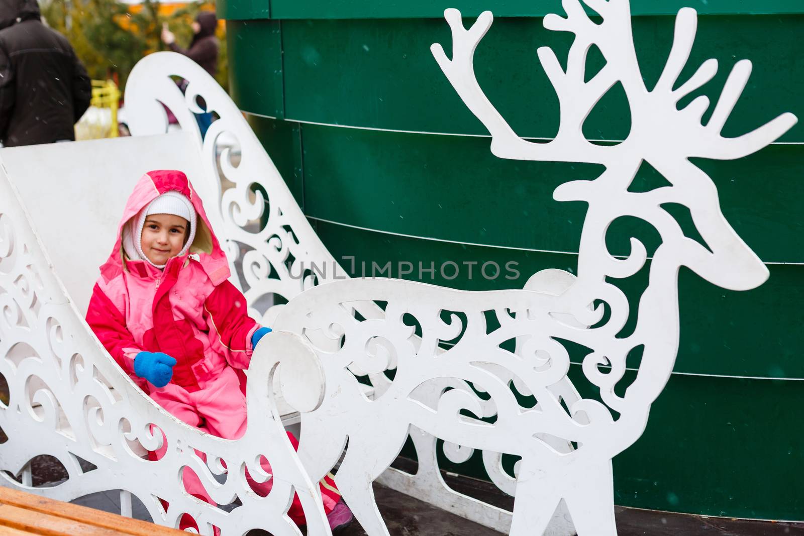 little girl outdoors at christmas time