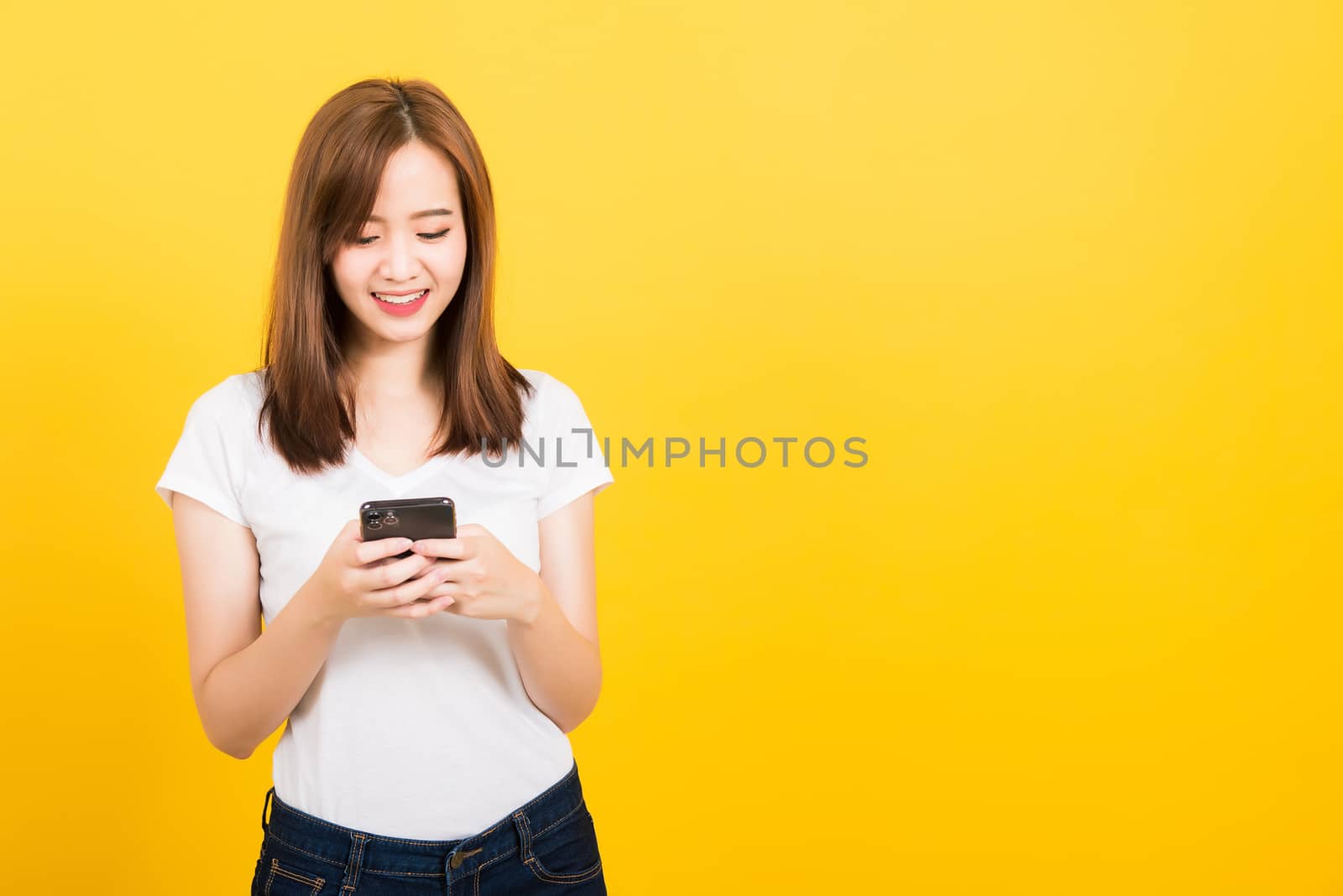 woman teen smile standing playing game or writing message on sma by Sorapop