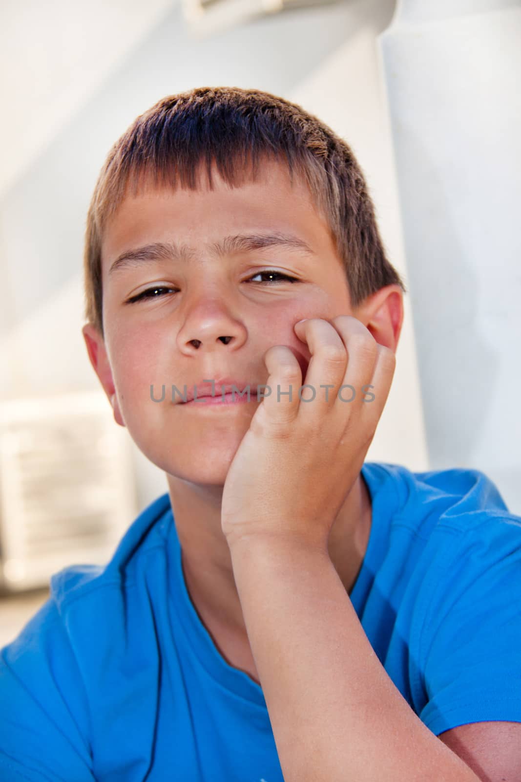 The carefree boy. The carefree boy dreams sitting on a porch by client111