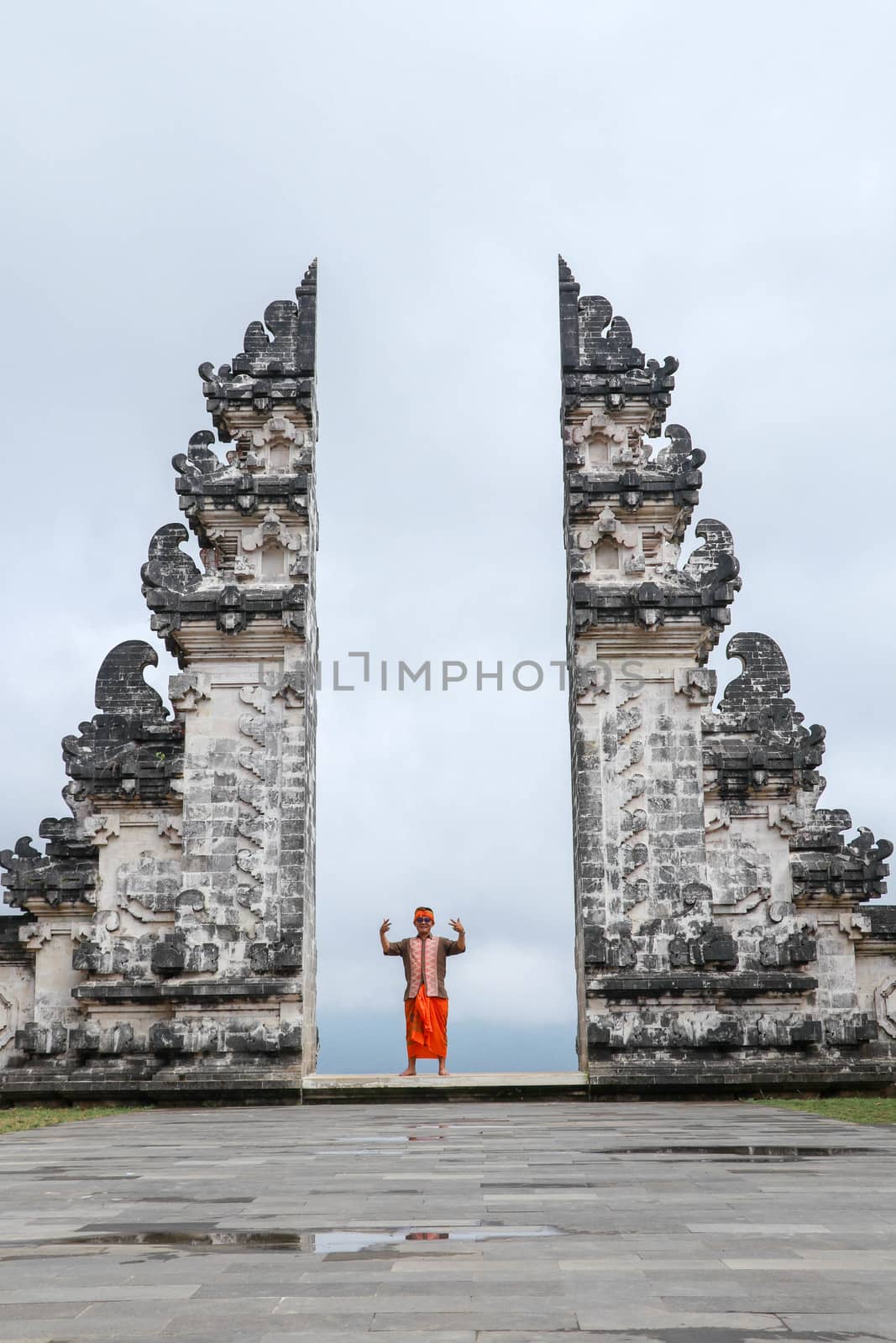 Man is standing in the gate of Lempuyang temple on Bali isalnd, Indonesia.