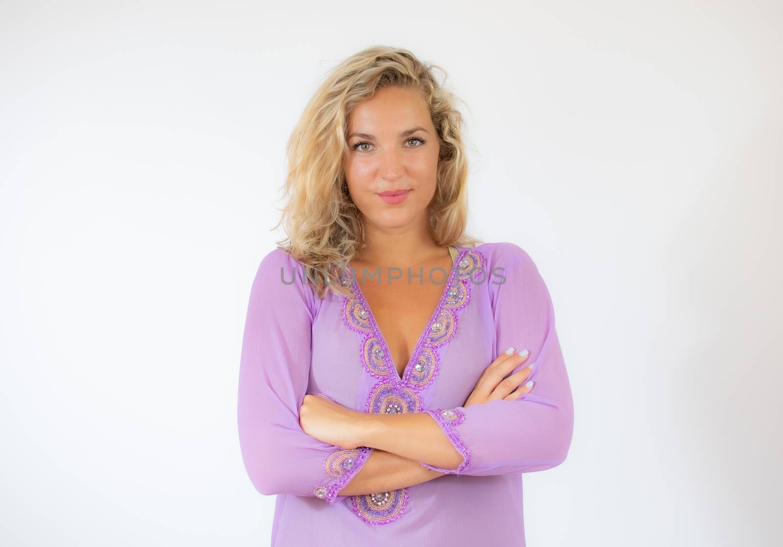 Beautiful Woman in purple dress smiling to the camera