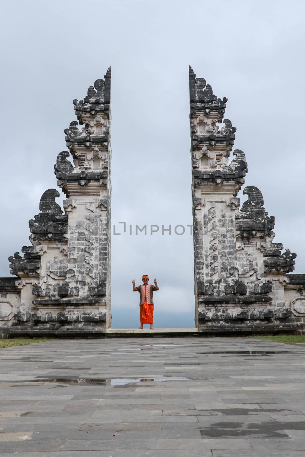Architecture, traveling and religion. Traveler enjoying the view in Hindu temple Lempuyang in Bali, Indonesia.