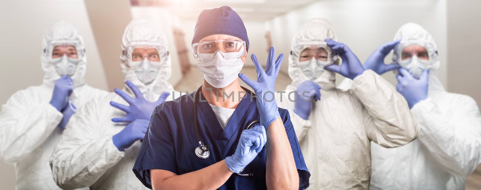 Team of Female and Male Doctors or Nurses Wearing Personal Prote by Feverpitched