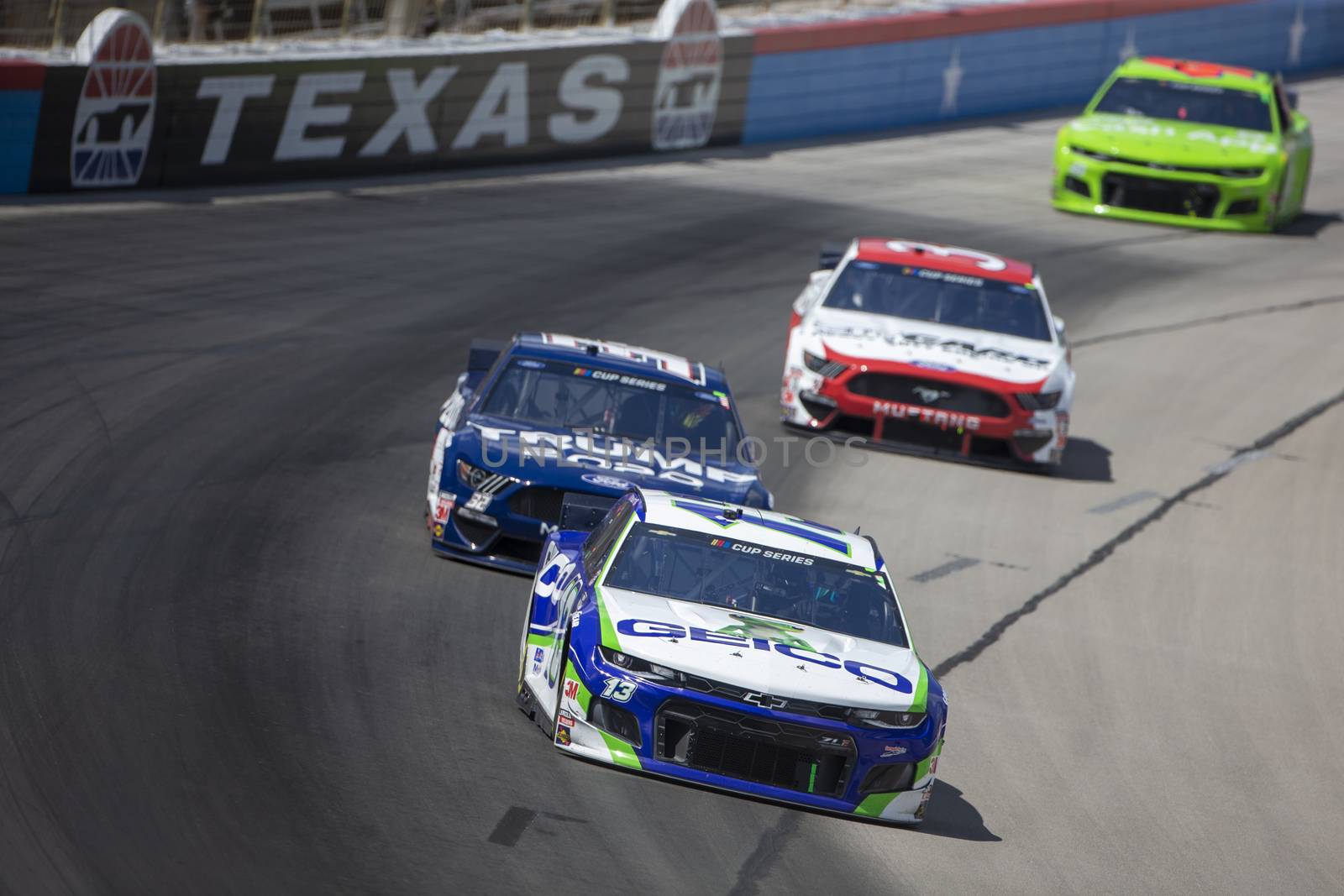 Ty Dillon (13) races for position for the O'Reilly Auto Parts 500 at Texas Motor Speedway in Fort Worth, Texas.