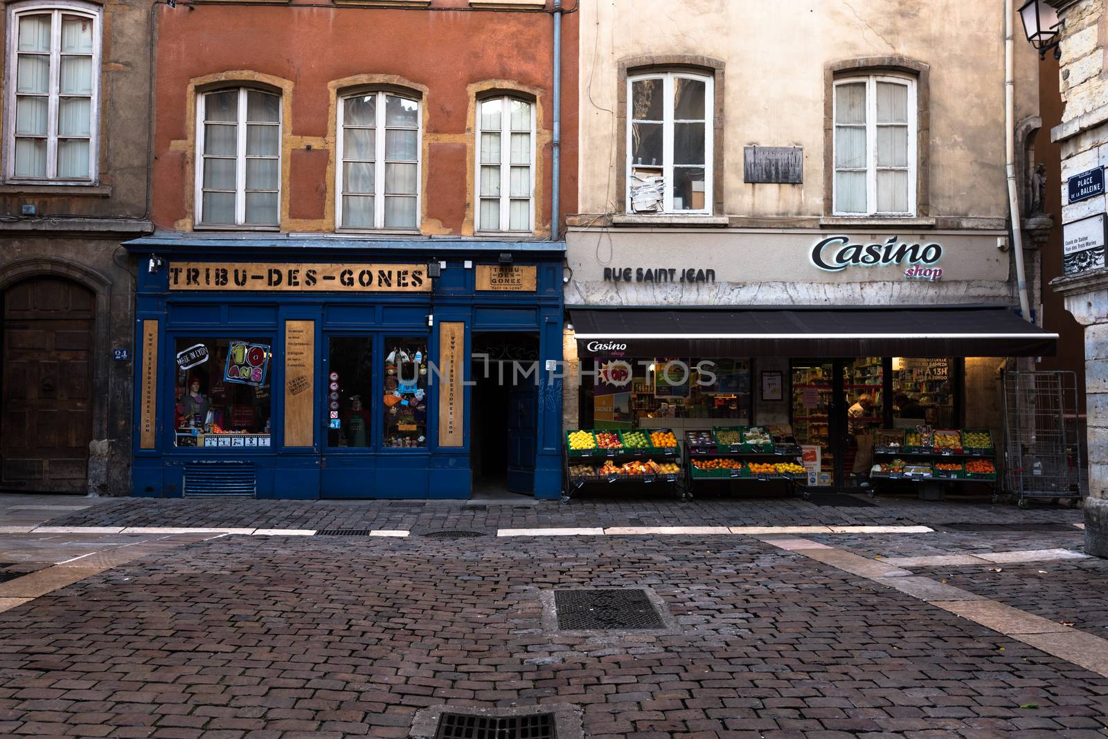 Lyon, France--November 6, 2017--Shops around a cobblestone square in the Old City section of Lyon. Editorial Use Only.