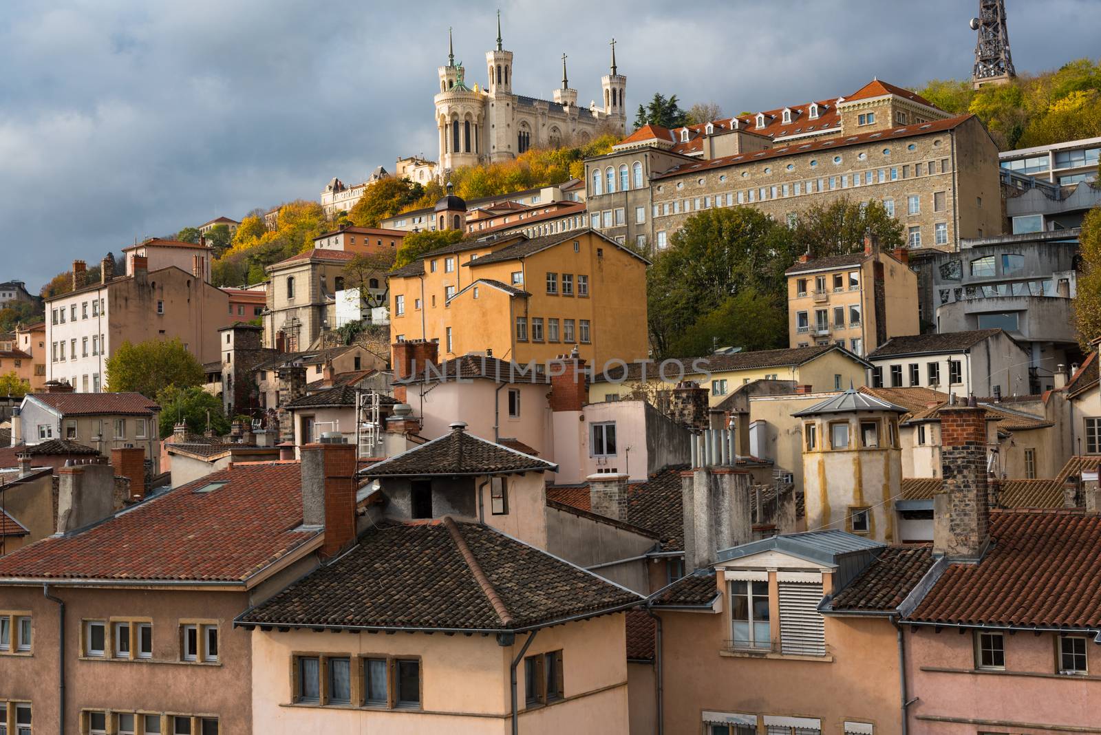Lyon, France--November 6, 2017--Dwellings around the  Old City section of Lyon. The Basilica of Notre-Dame de Fourviere is at the top of the hill. Editorial Use Only.