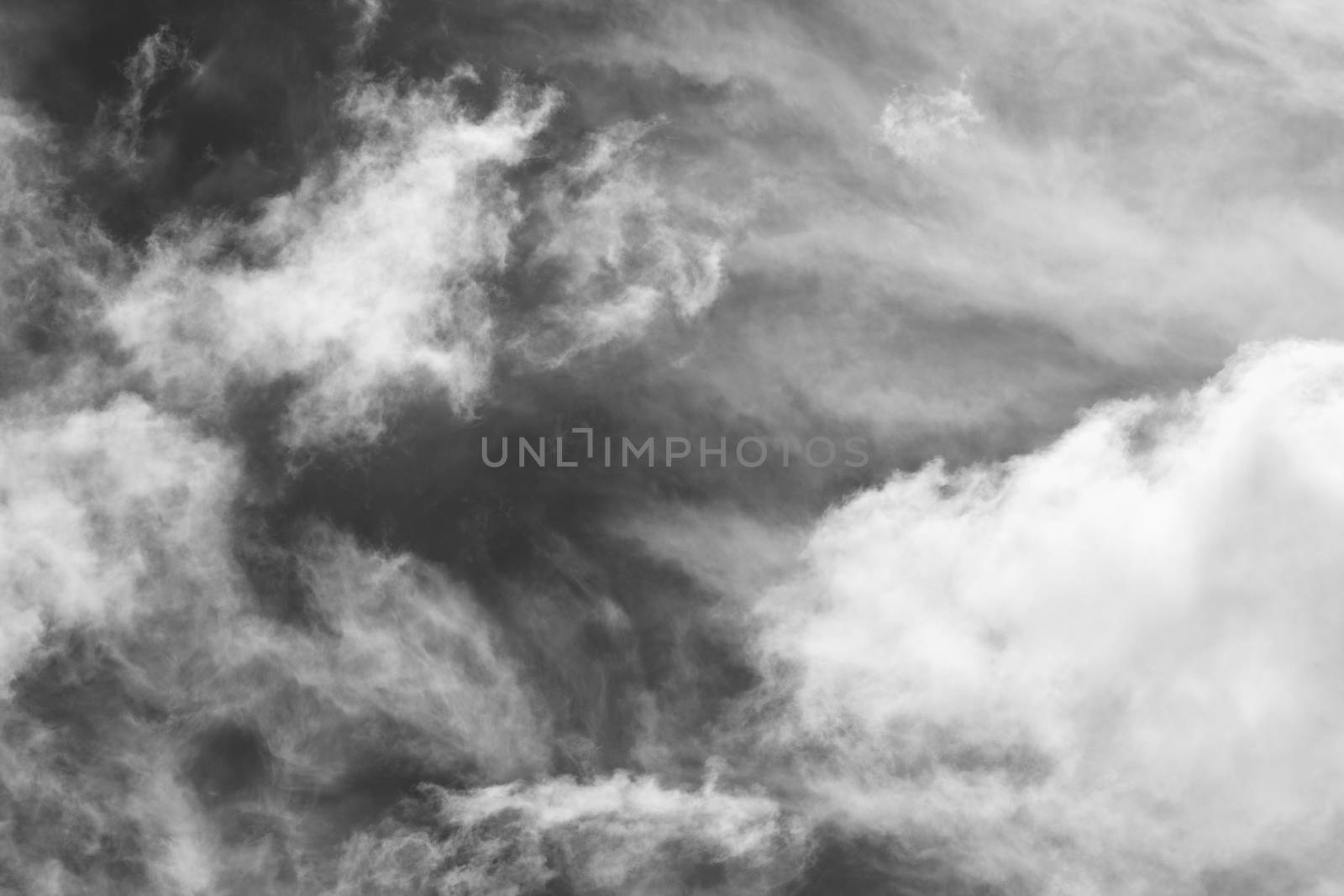 Cloudscape texture background of black and white dramatic monochrome cumulus clouds