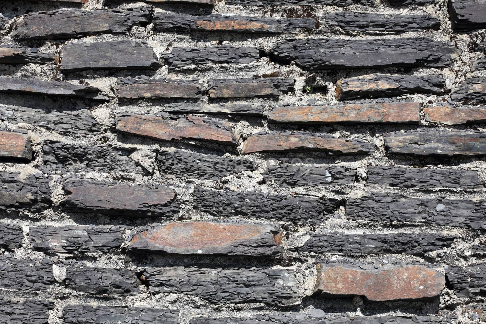 Old weathered rustic stone brick wall texture background