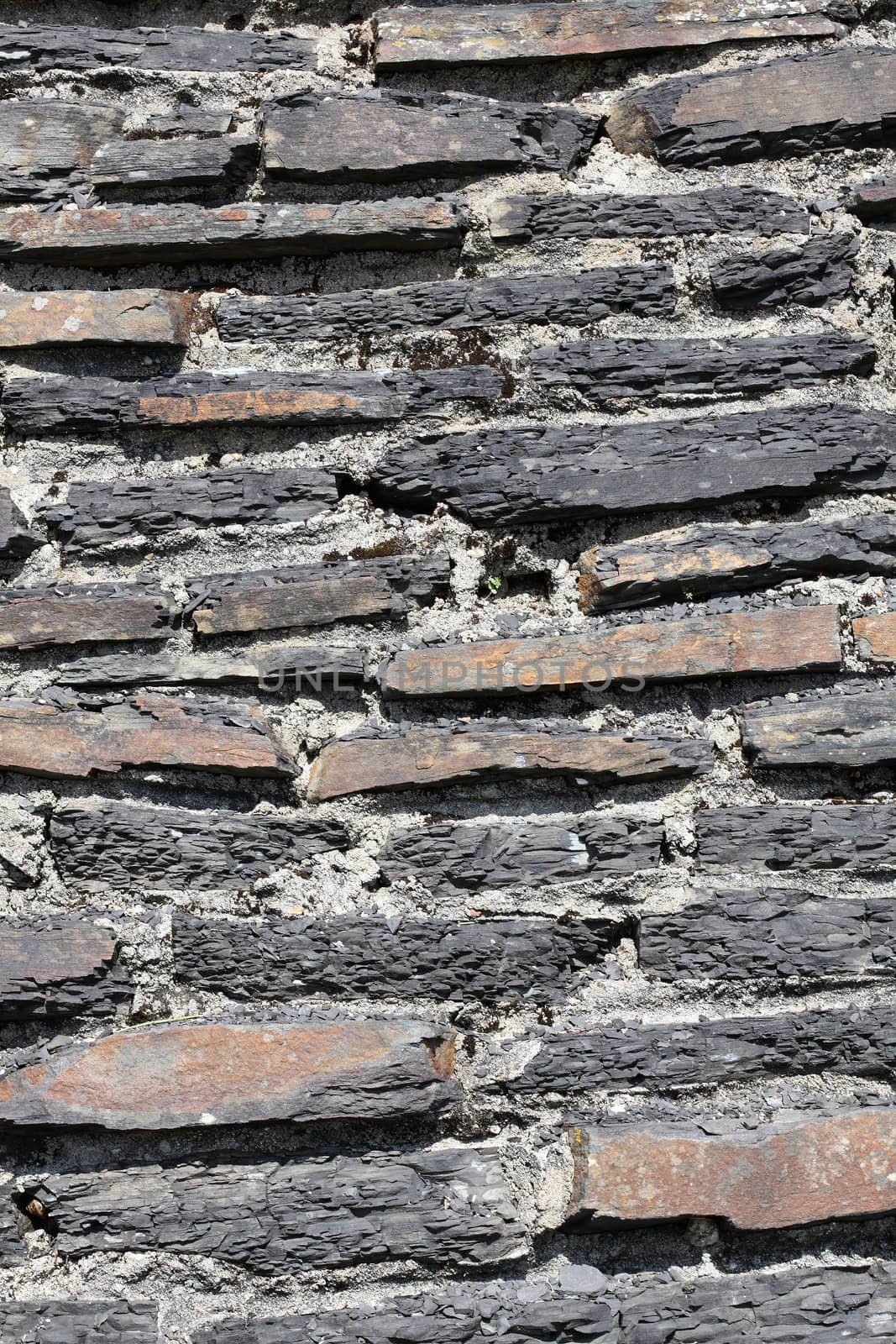 Old weathered rustic stone brick wall texture background