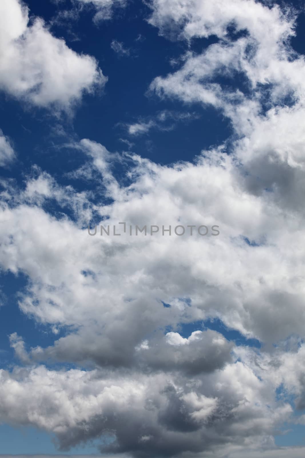 Cloudscape texture background of dramatic cirrus and cumulus clouds