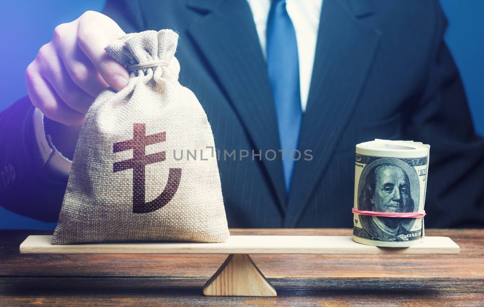 A man puts turkish lira money bag on the scales opposite to the dollar. Protecting savings from inflation. Investments in foreign currency bonds. Exchange rate, comparison of economic indicators.