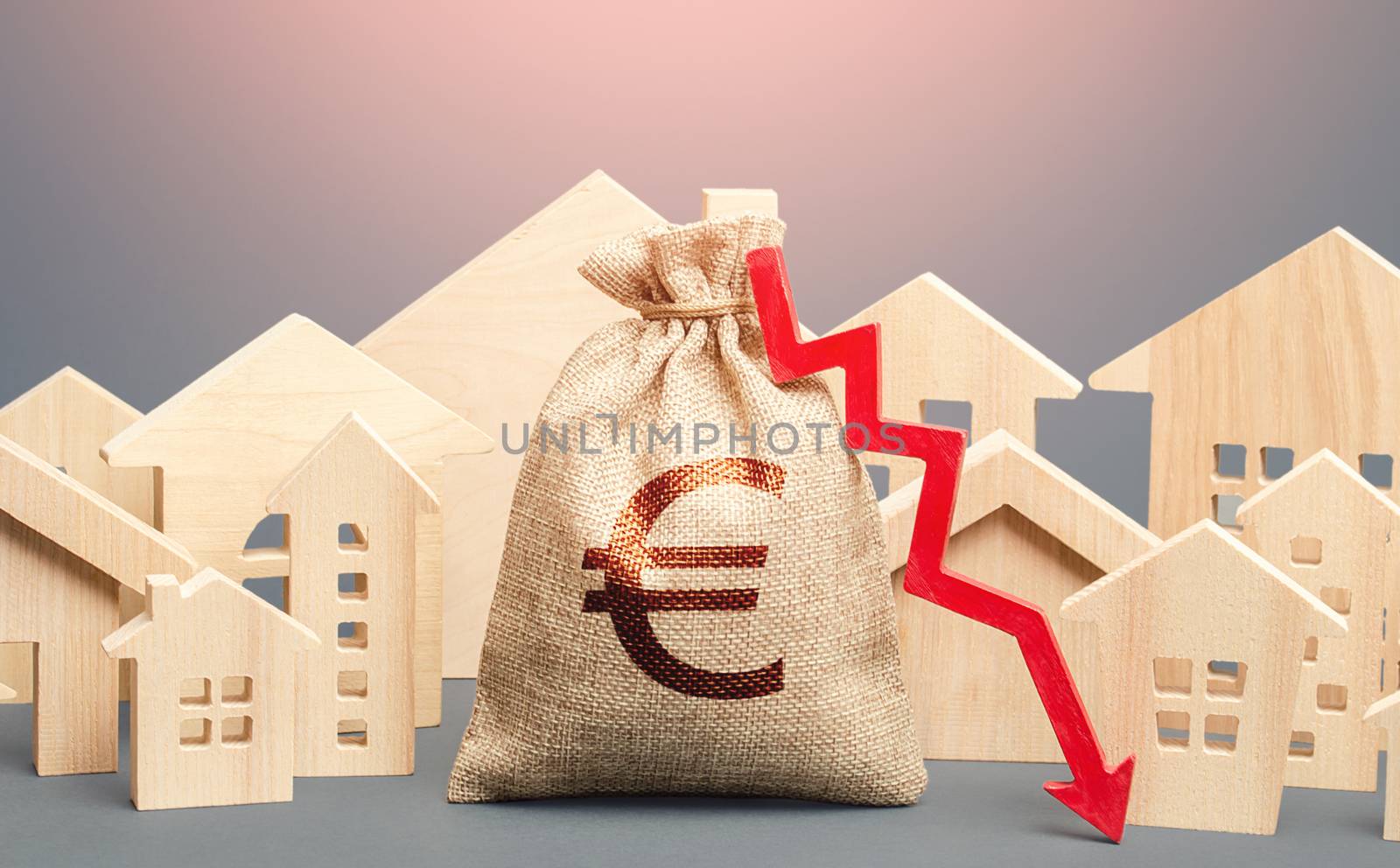 City residential buildings and euro money bag with a red down arrow. Falling prices for rental apartments. Lower mortgage interest rates. Low cost of real estate. Reducing demand for home buying