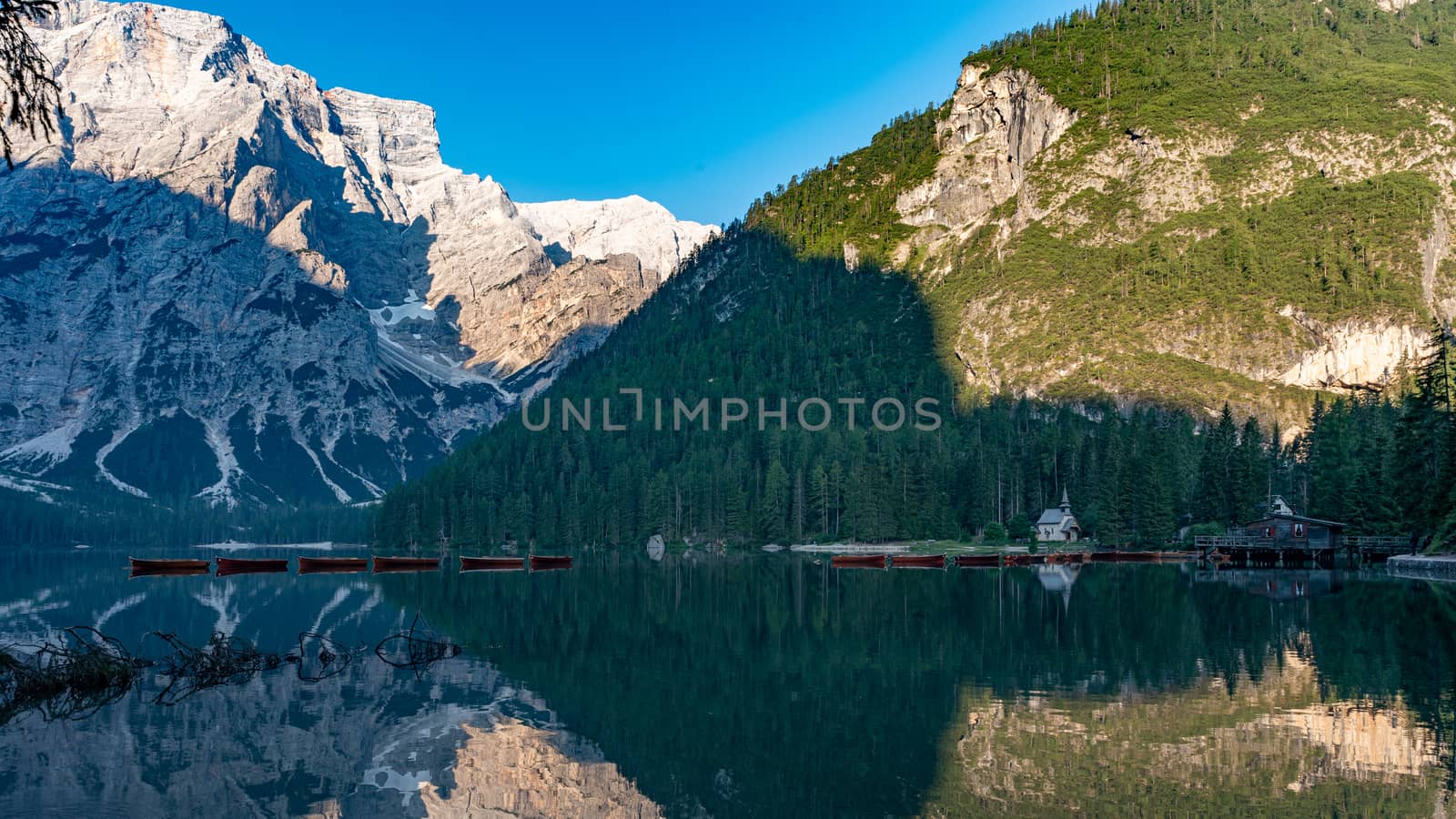 Mountain landscape with reflections on the Braies lake in Val Pusteria, South Tyrol Dolomites