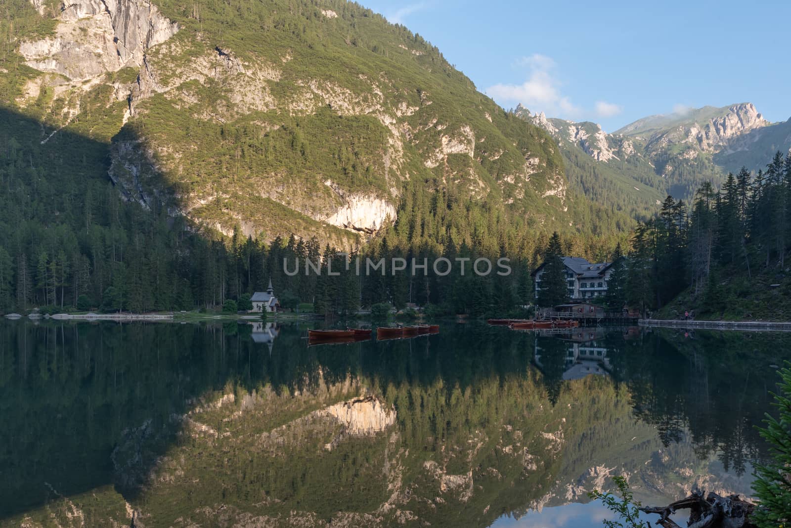 Mountain landscape with reflections on the Braies lake in Val Pusteria, South Tyrol Dolomites