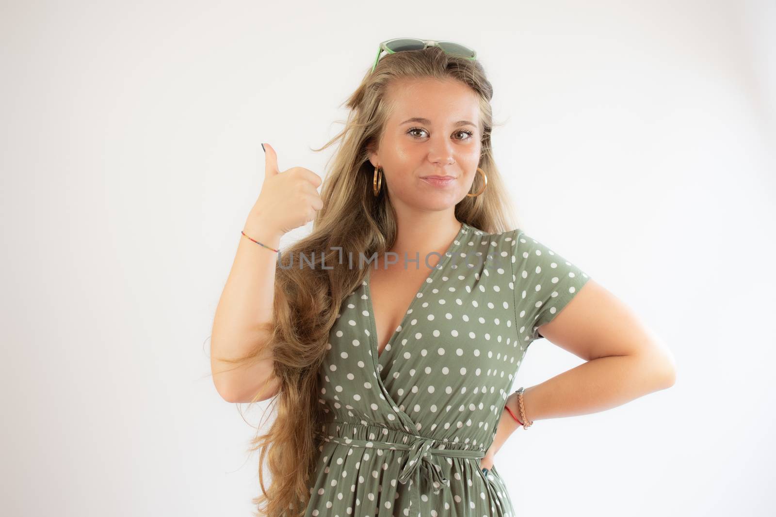 Portrait of a pretty young girl in green dress