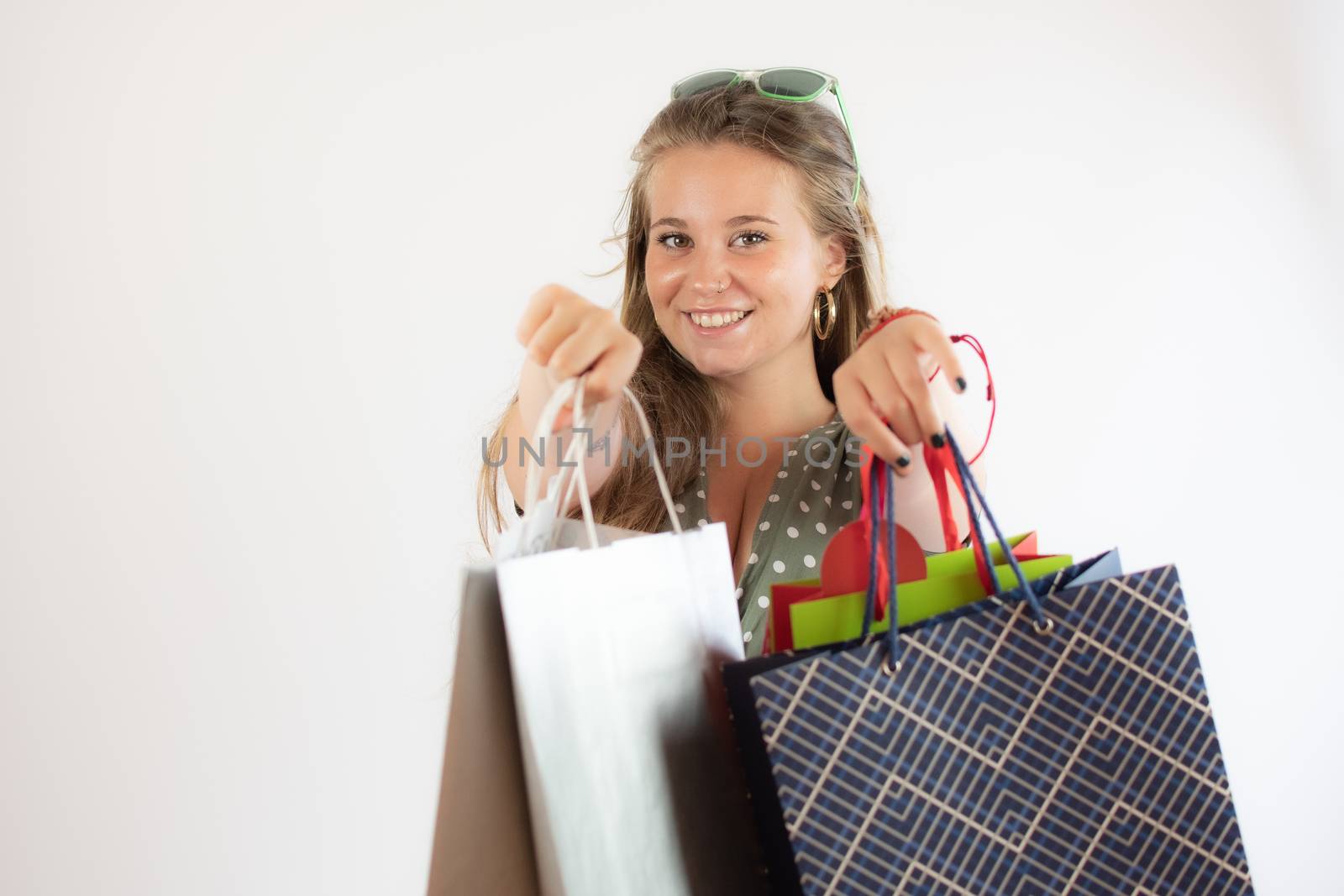 Beautiful young girl shopping with bags in hand