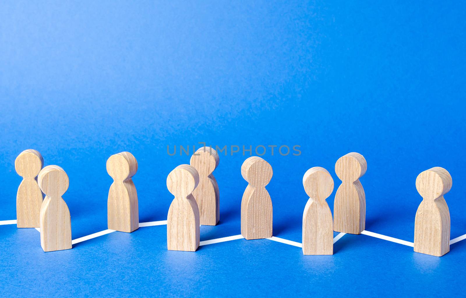 Chain of people figurines connected by lines. Cooperation and interaction between people and employees. Dissemination of information in society, rumors. Communication and social networks.