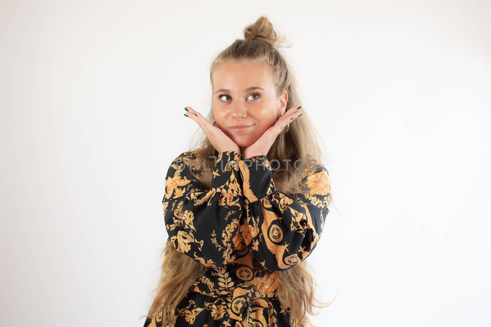 Portrait of a pretty blonde young girl smiling