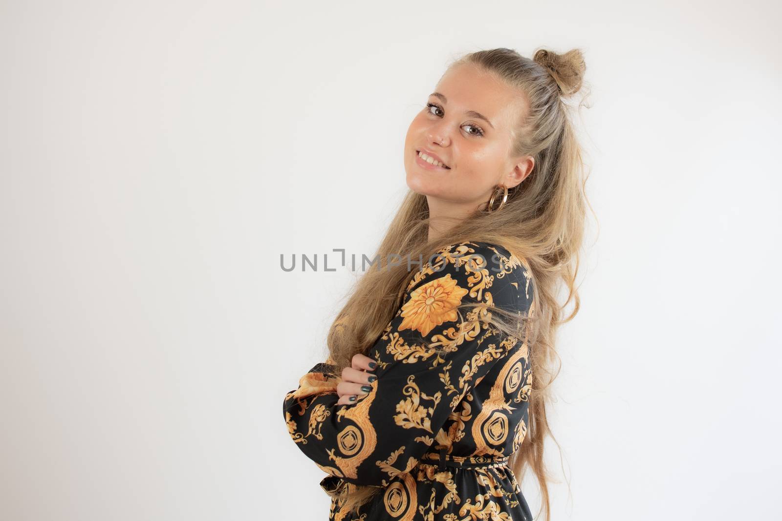 Portrait of a pretty blonde young girl smiling