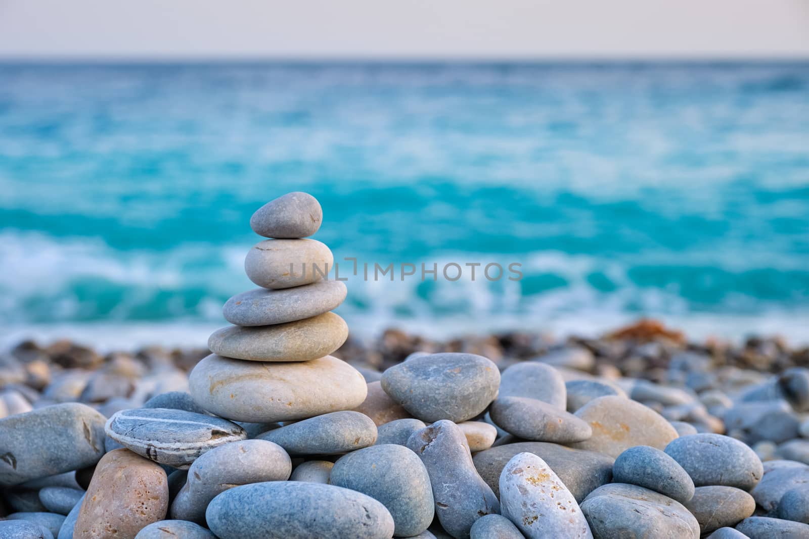 Zen balanced stones stack on beach by dimol
