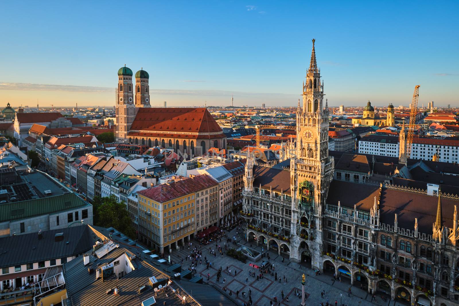 Aerial view of Munich - Marienplatz, Neues Rathaus and Frauenkirche from St. Peter's church on sunset. Munich, Germany