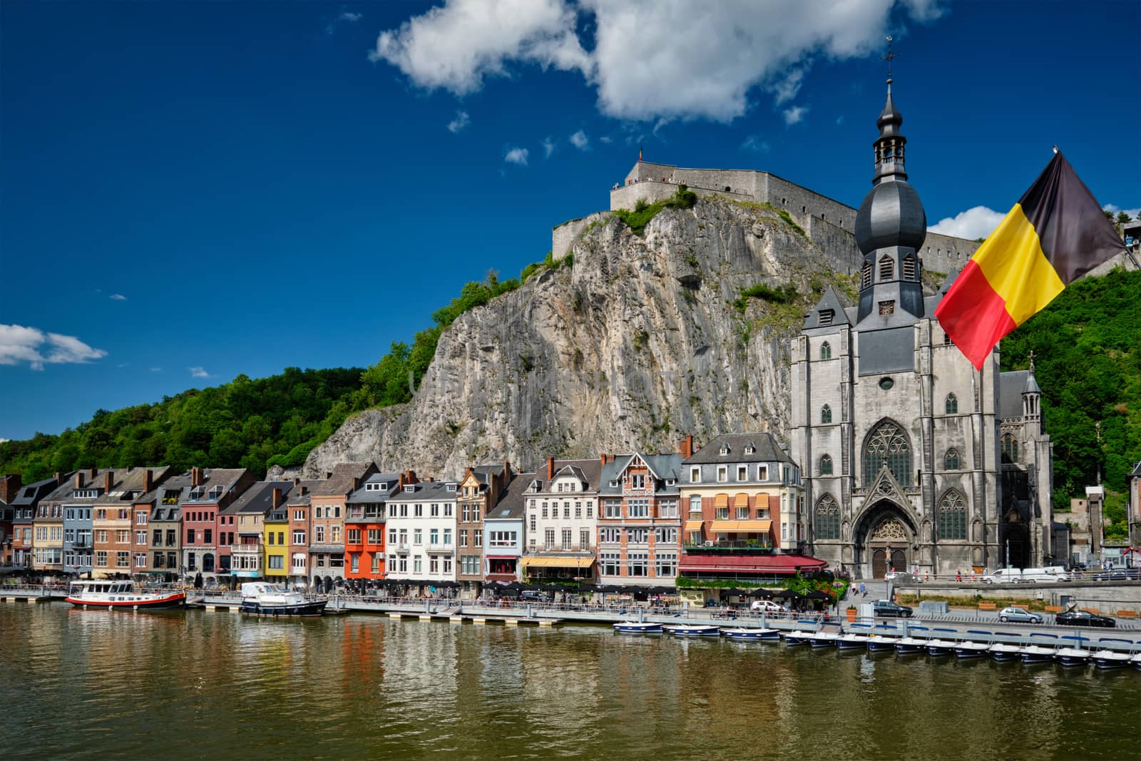 View of picturesque Dinant town, Dinant Citadel and Collegiate Church of Notre Dame de Dinant over the Meuse river. Belgian province of Namur, Blegium