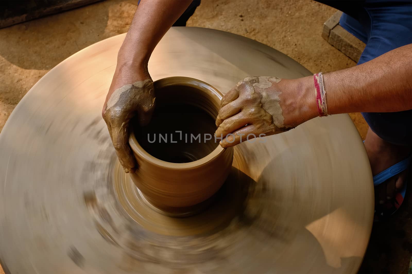 Indian potter hands at work, Shilpagram, Udaipur, Rajasthan, India by dimol