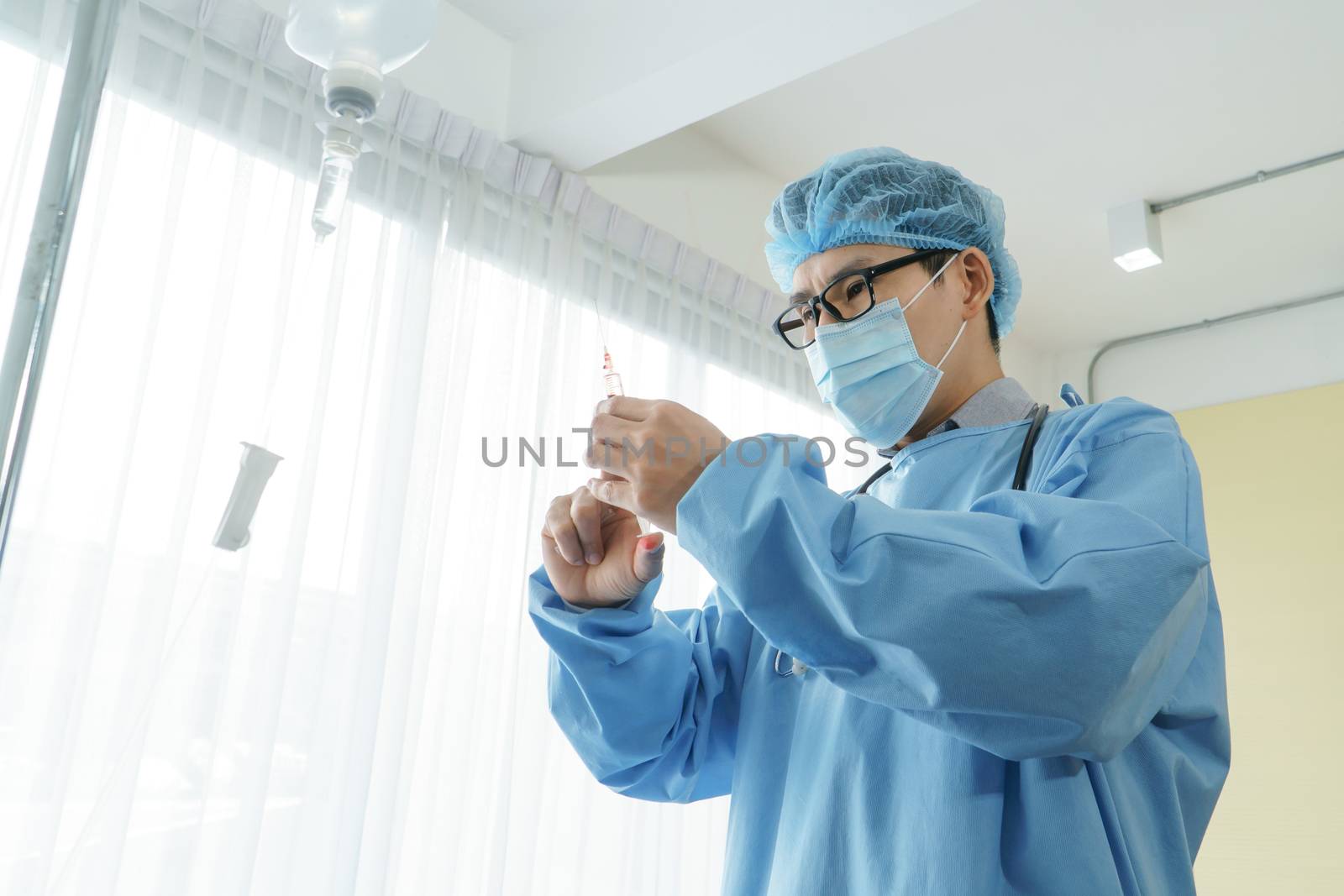Portrait of a professional surgeon, an Asian man carrying a stethoscope operating in an emergency room. Modern medical technology and science. Concepts of care and rehabilitation in hospital patients.