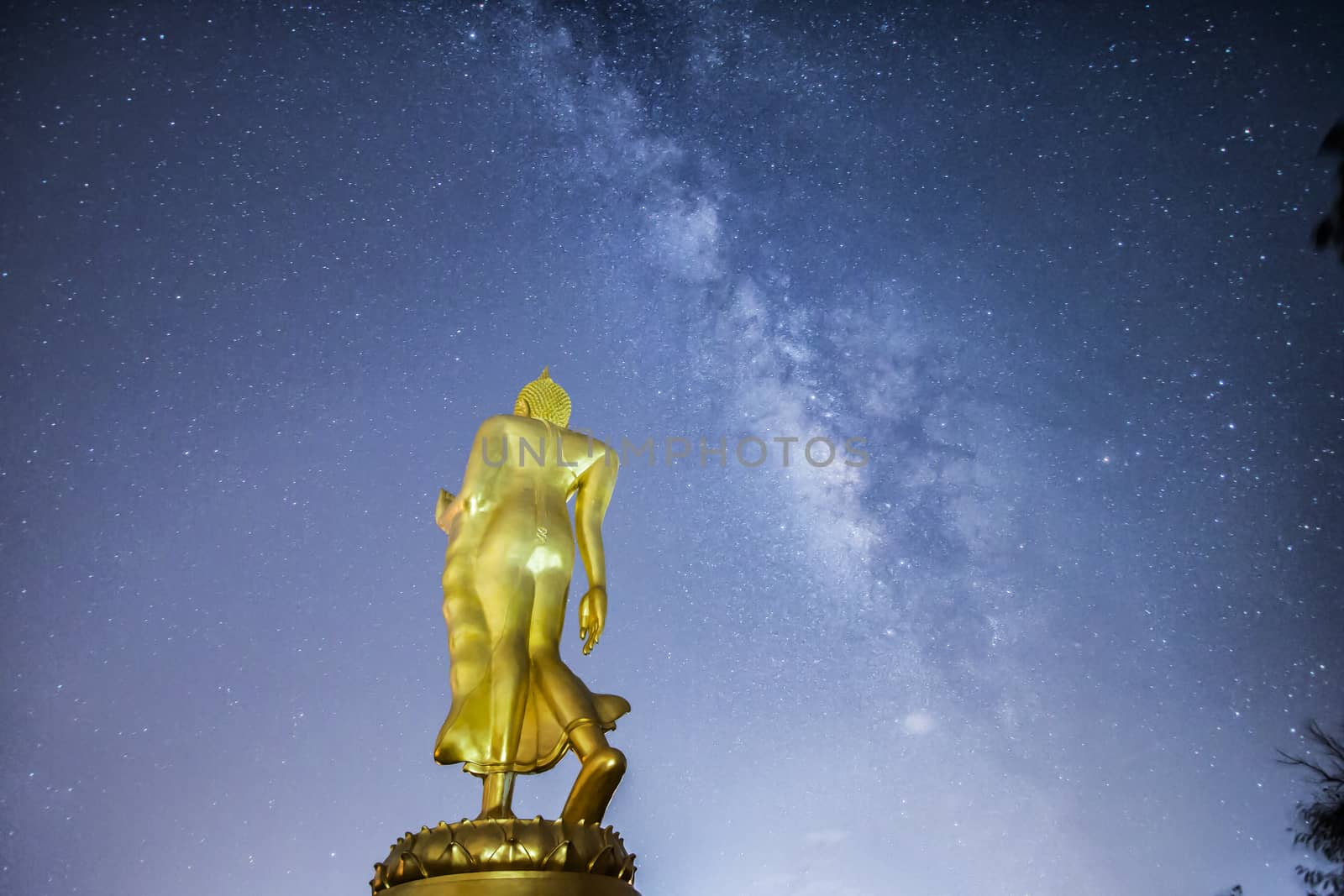 Buddha statue on the milky way background in Thailand