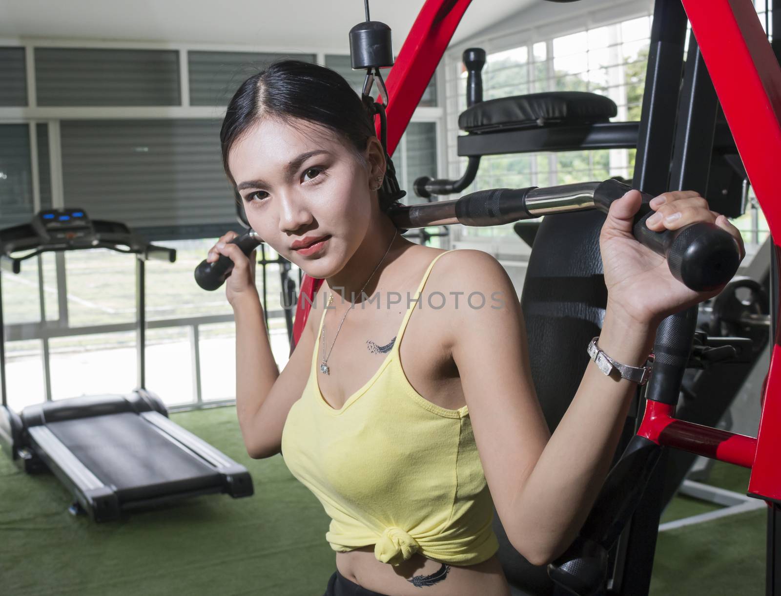 Asian beautiful muscular fit woman exercising building muscles,Healthy life style concept
