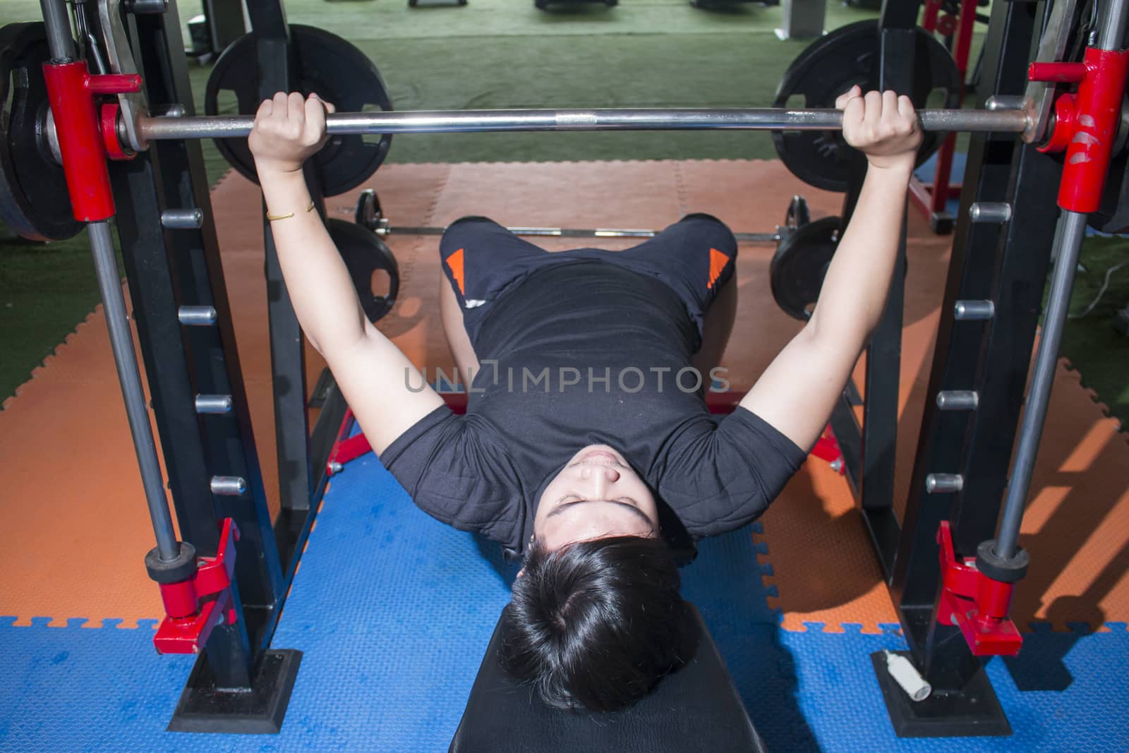 Weight Training Workout Exercise Fitness Concept,asian  man with weight training equipment on sport gym club