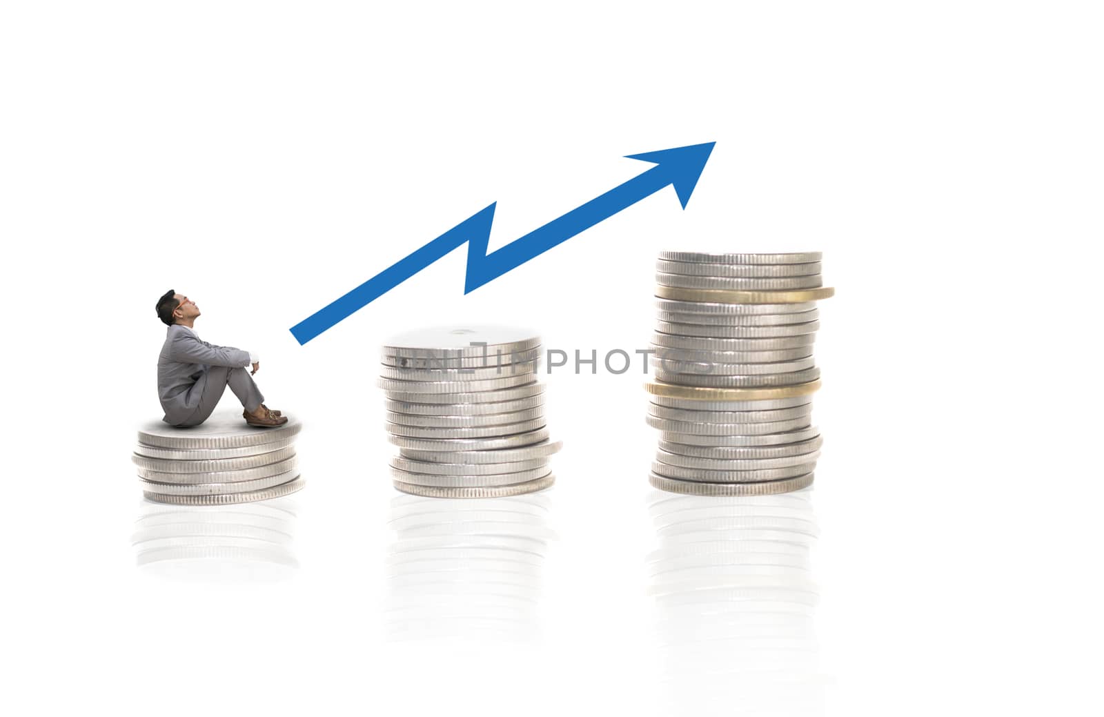 asian businessman sitting on coins stack,,investment concept on white background