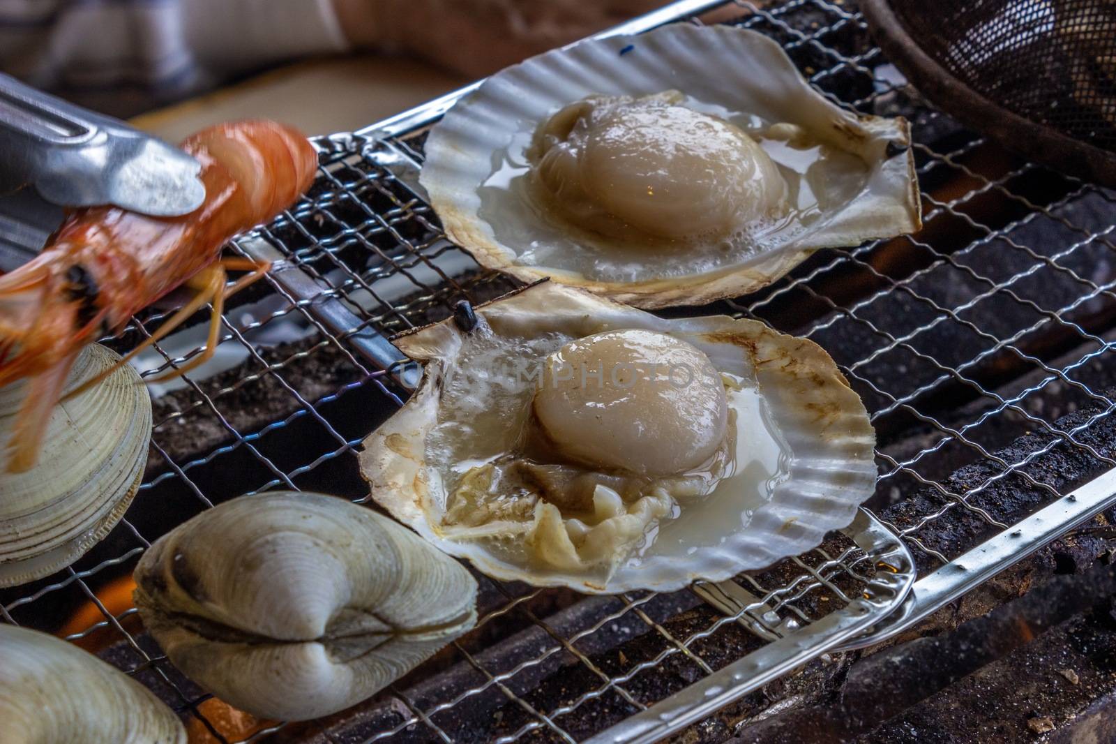 Clam,Quahog,shrimp,scallop shell,Charcoal-grilled seafood.in chiba-ken JAPAN by Umbrella