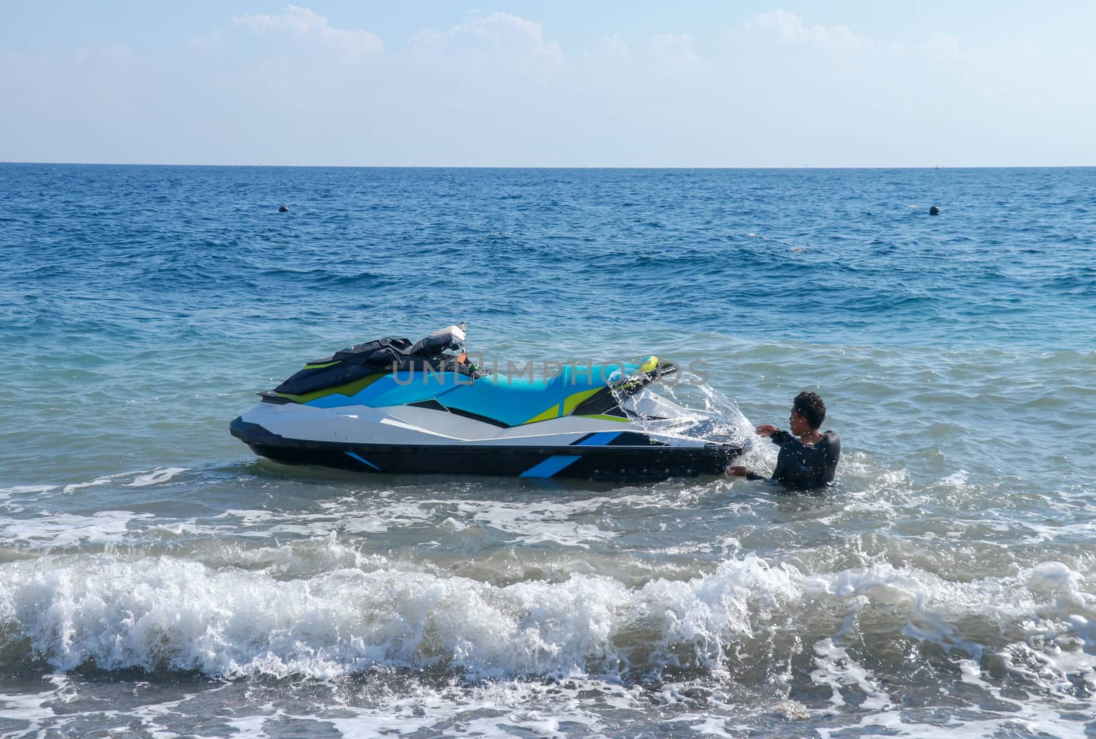 Jetski floating on blue sea water. Strong power watercraft is waiting customers.