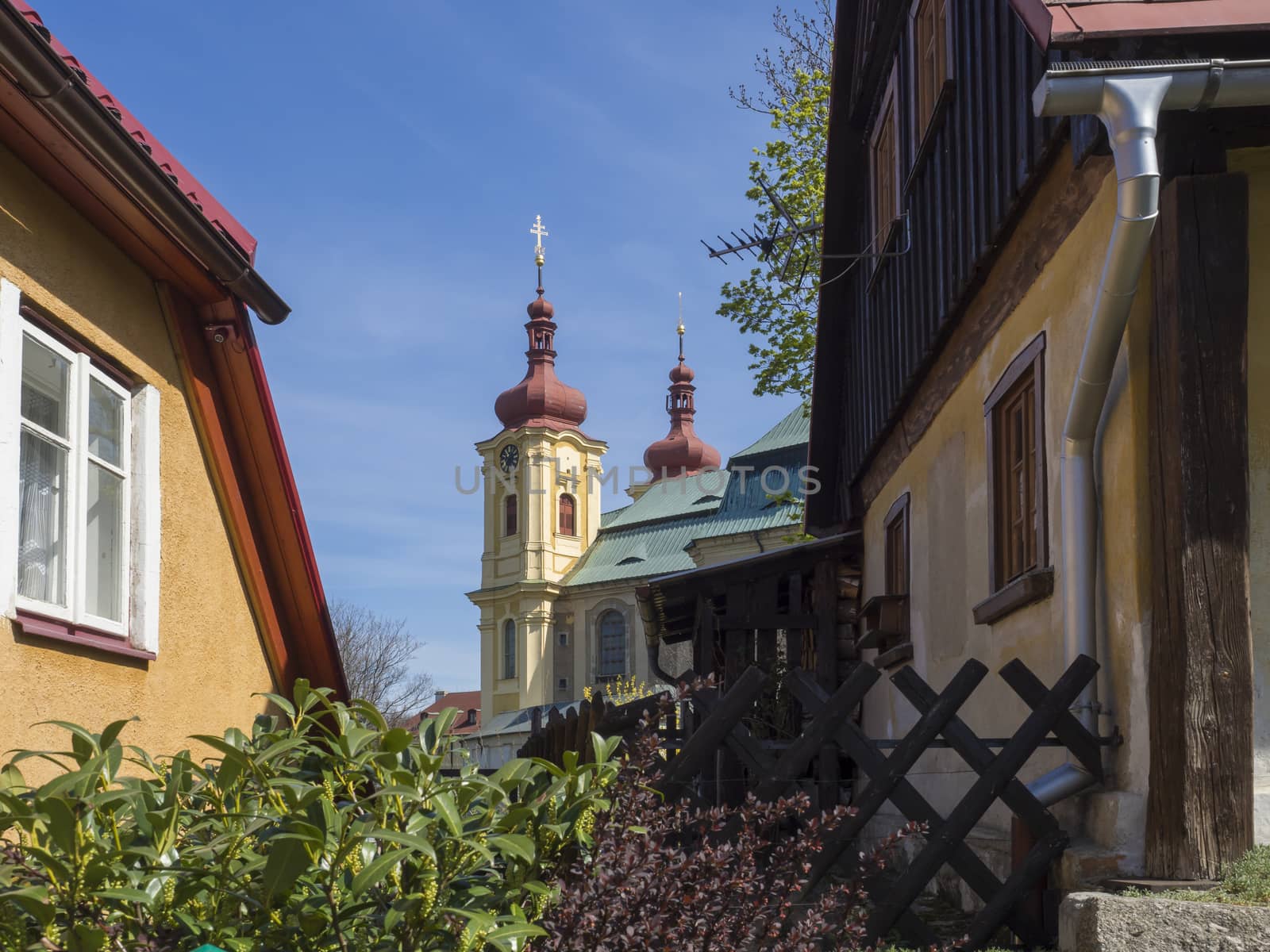 Village Hejnice with View on Baroque Basilica church of the Visitation Virgin Mary in spring, place of pilgrimage, Hejnice, Jizera mountain, Czech Republic.