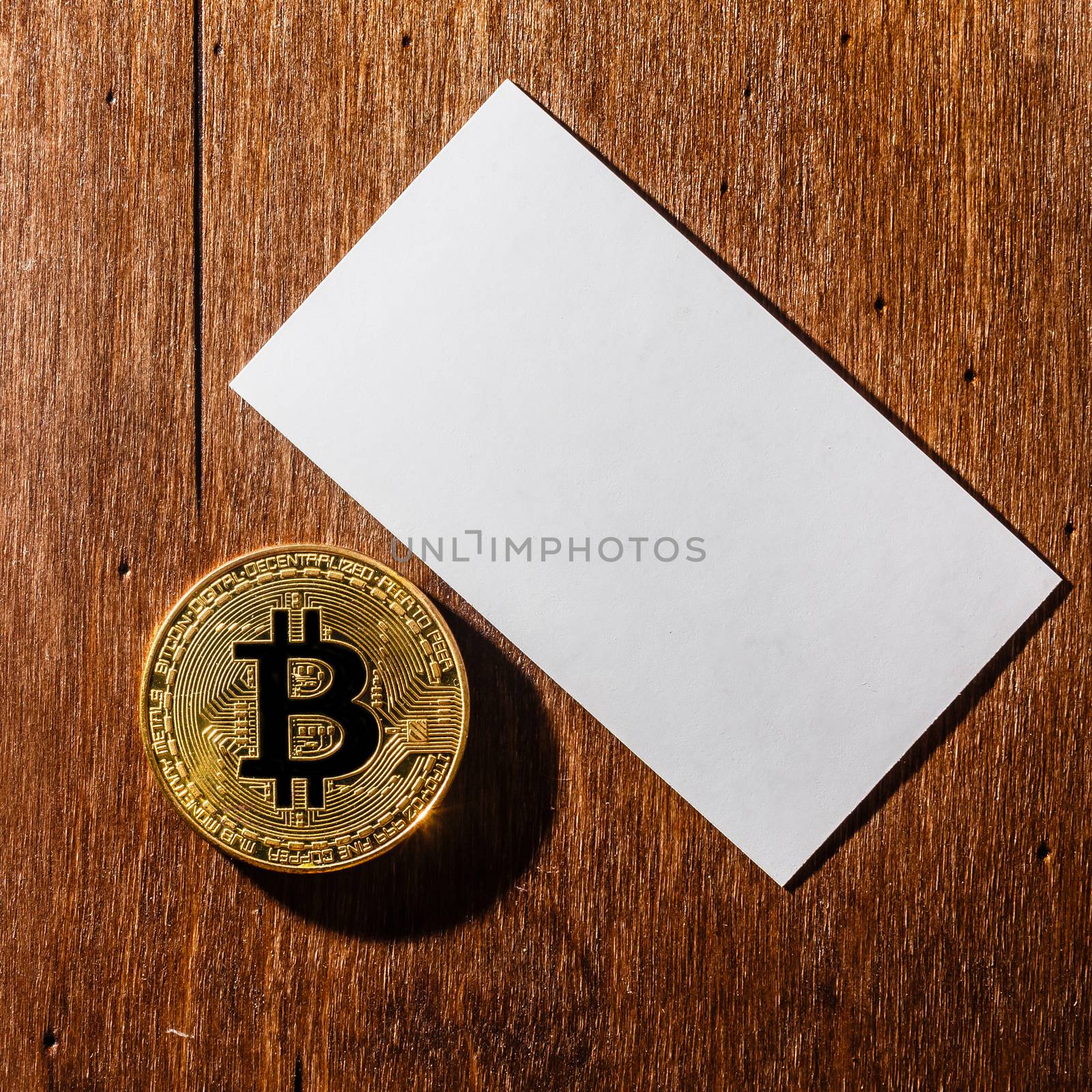 We accept bitcoins Business cards. Stack of blank horizontal business cards propped up another.