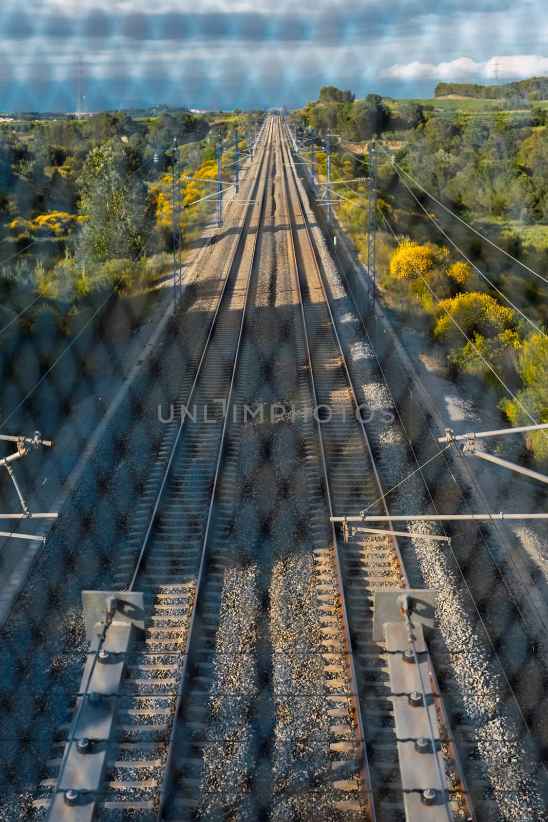 Train track between the mountains by Dumblinfilms