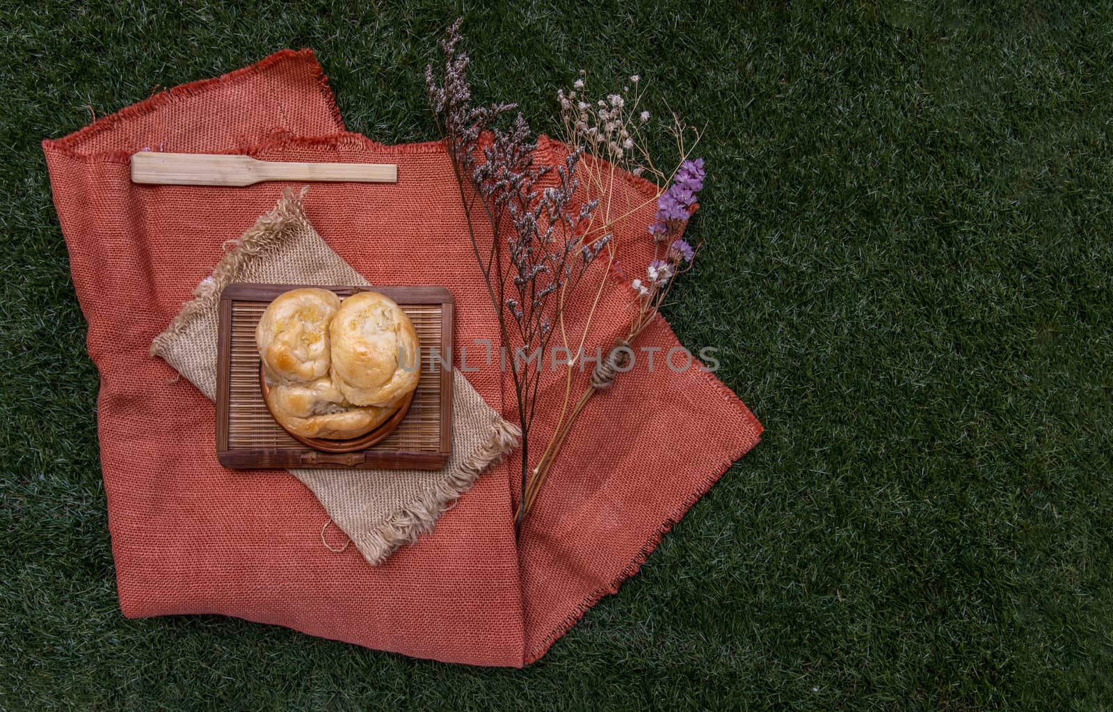 Traditional homemade bread thai : Coconut Bread bake on wooden tray. One piece, Selective focus.