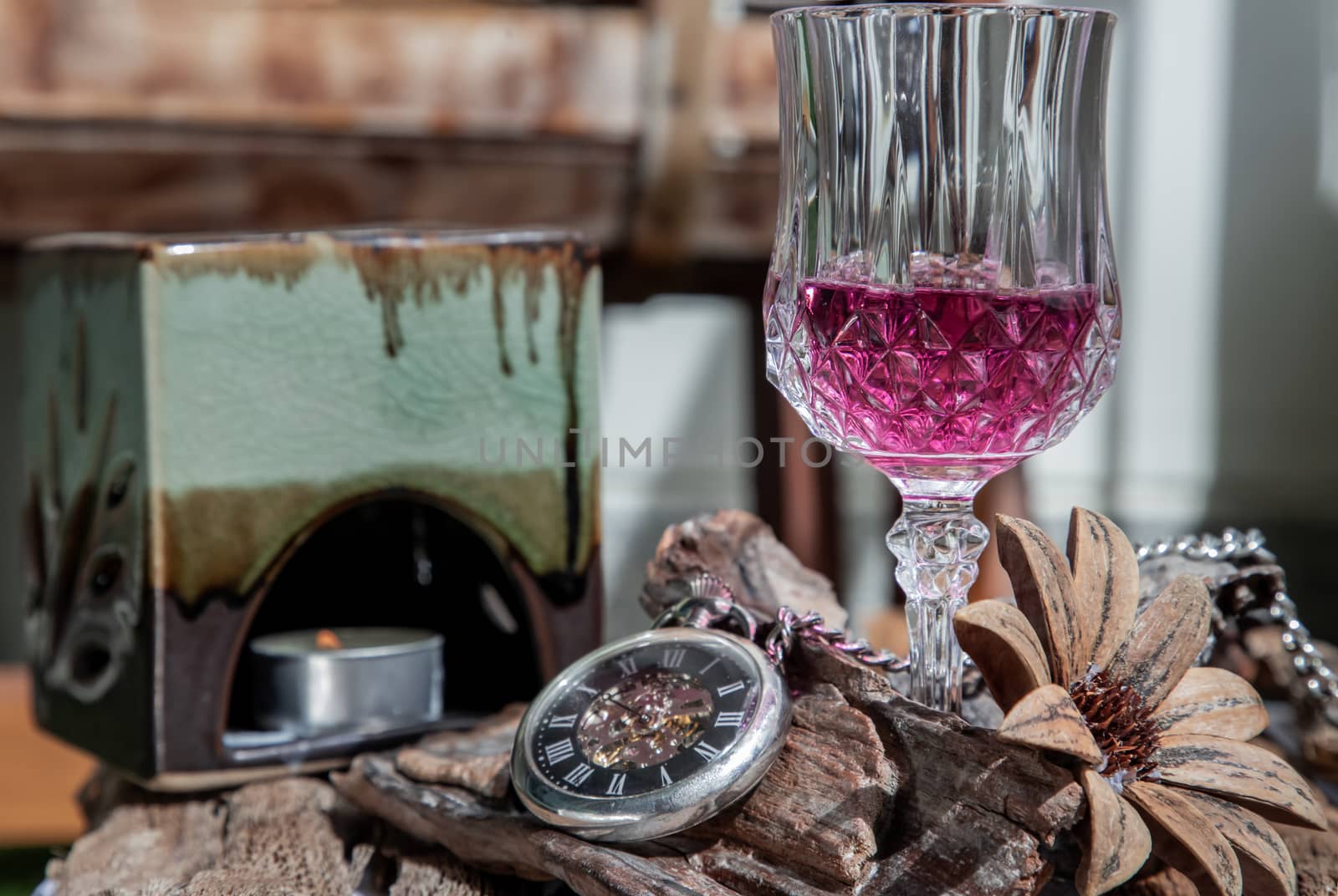 Grape juice with A retro pocket watch on wooden background.  by tosirikul