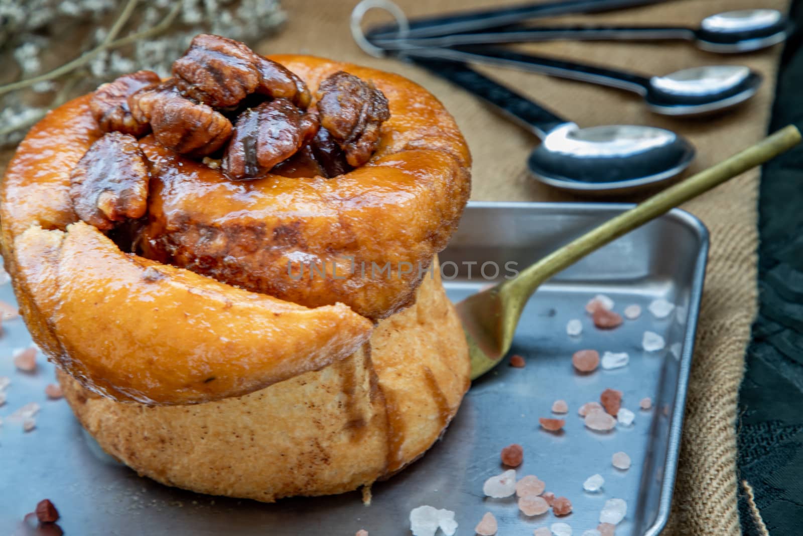 Traditional French sweet dessert : Pecan peanut Brioche on the silver tray. Delicious seasonal breakfast, Oblique view from the top. Selective focus.