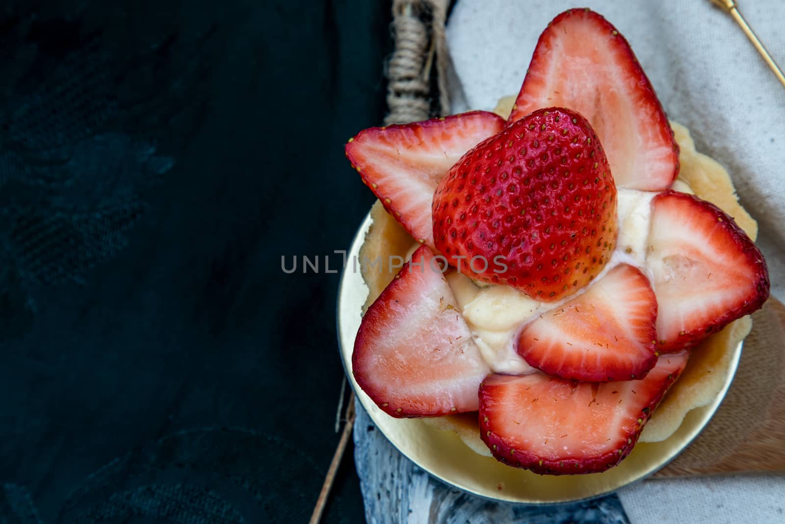 Traditional French sweet dessert : Strawberry tart on beautiful background. One piece, Delicious seasonal breakfast. Top view, Selective focus.