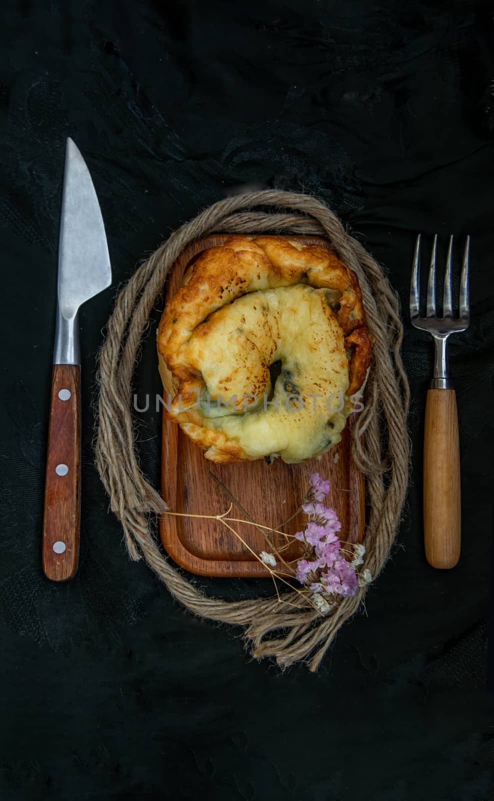 Traditional French sweet dessert : Spinach Brioche on the wooden tray. One piece, Delicious seasonal breakfast. Top view, Selective focus.