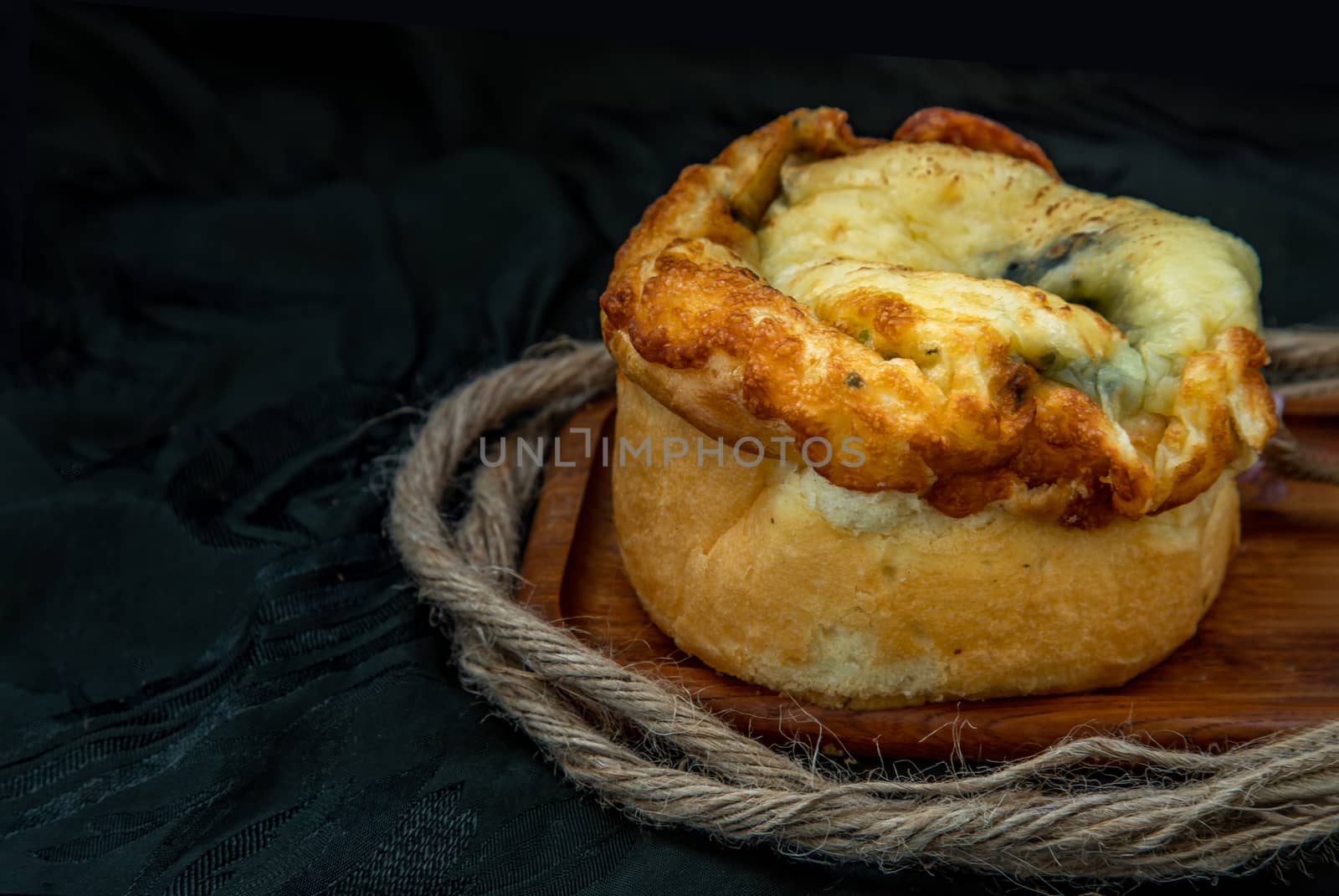 Traditional French sweet dessert : Spinach Brioche on the wooden tray. One piece, Delicious seasonal breakfast. Oblique view from the top, Selective focus.