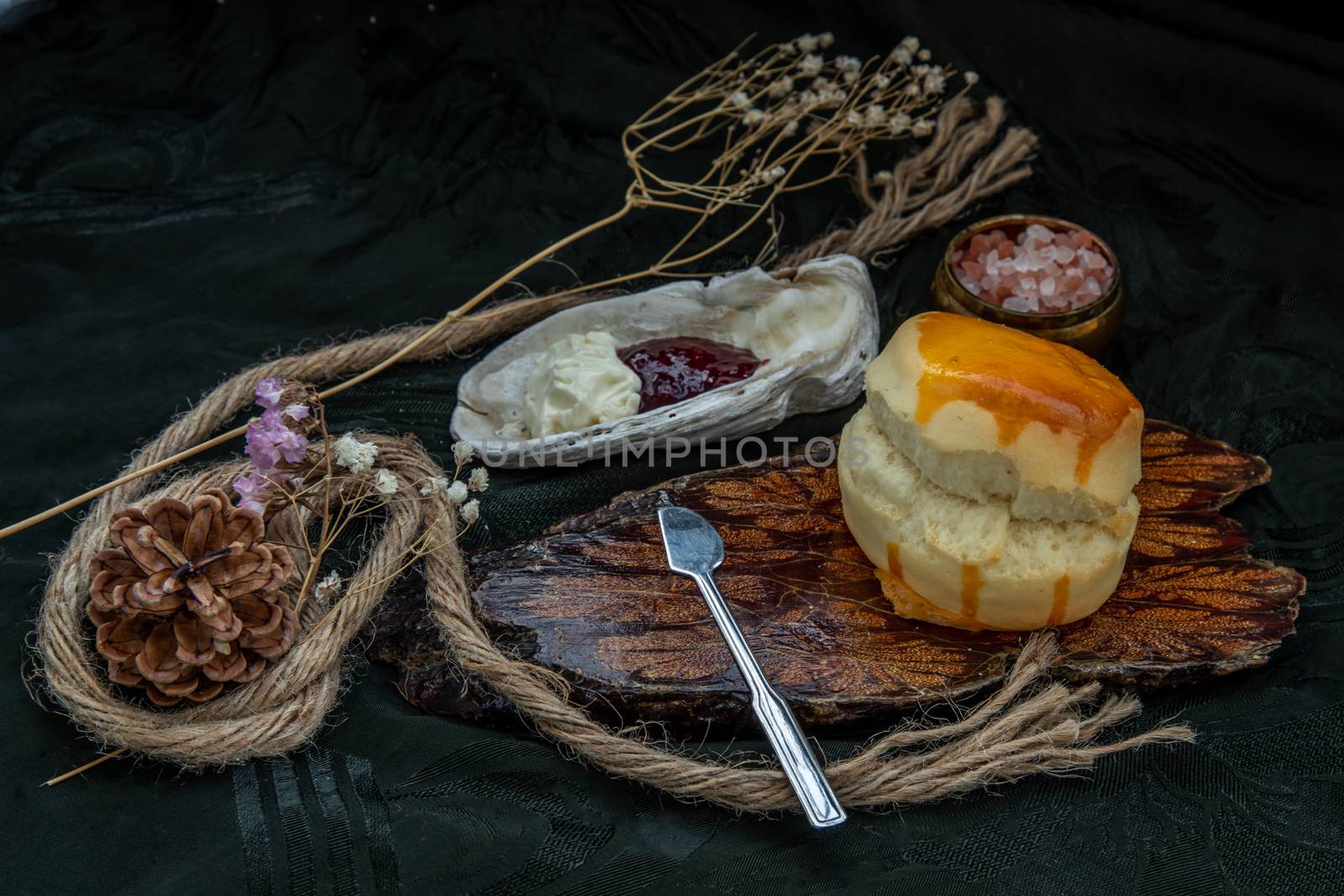 Traditional french sweet dessert : Scones on the wooden tray served with Homemade raspberry jam and Mascarpone cheese on Shell. Delicious seasonal breakfast. Selective focus.