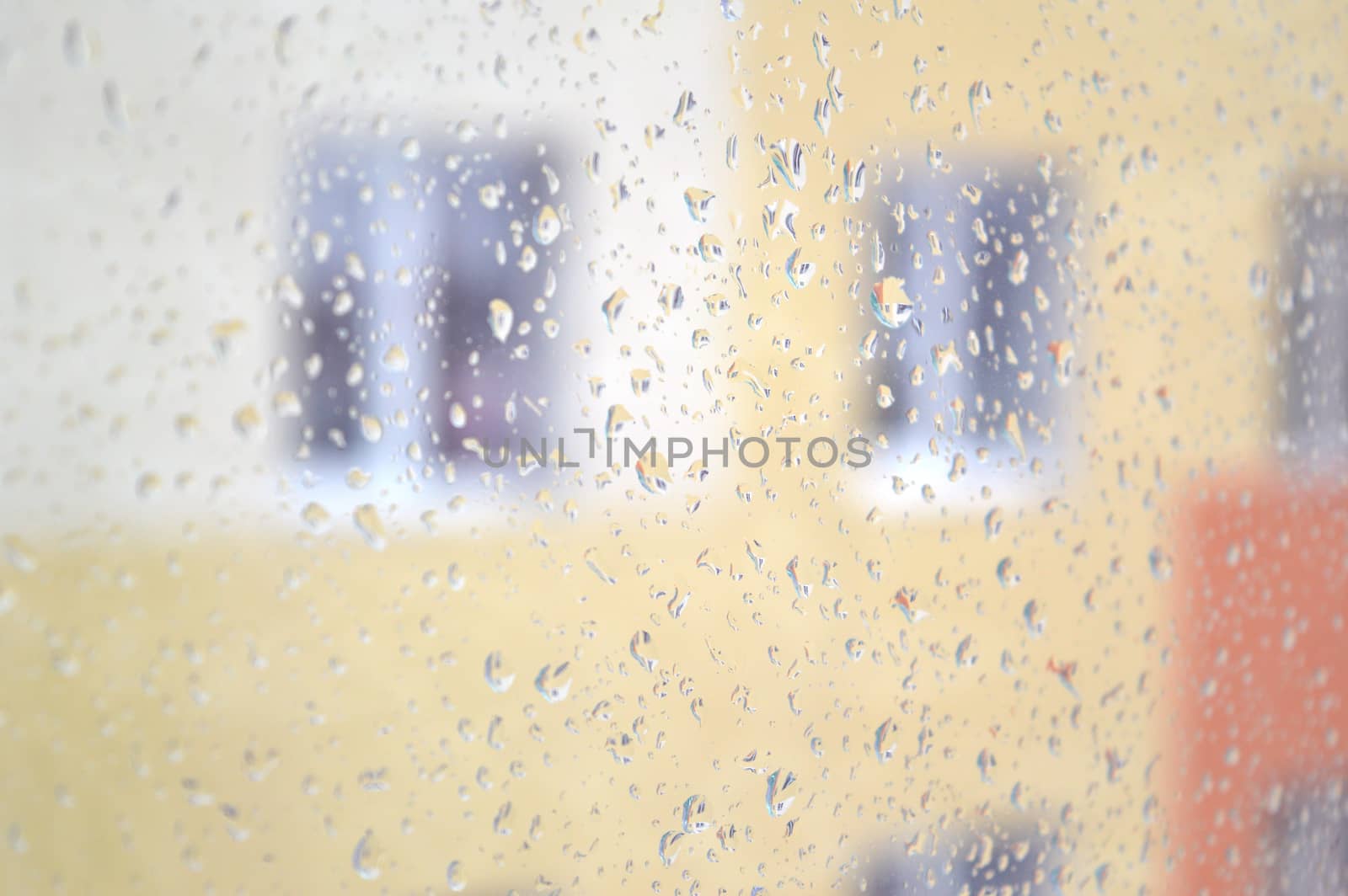 Drops of rain on the window, rainy day. Shallow DOF