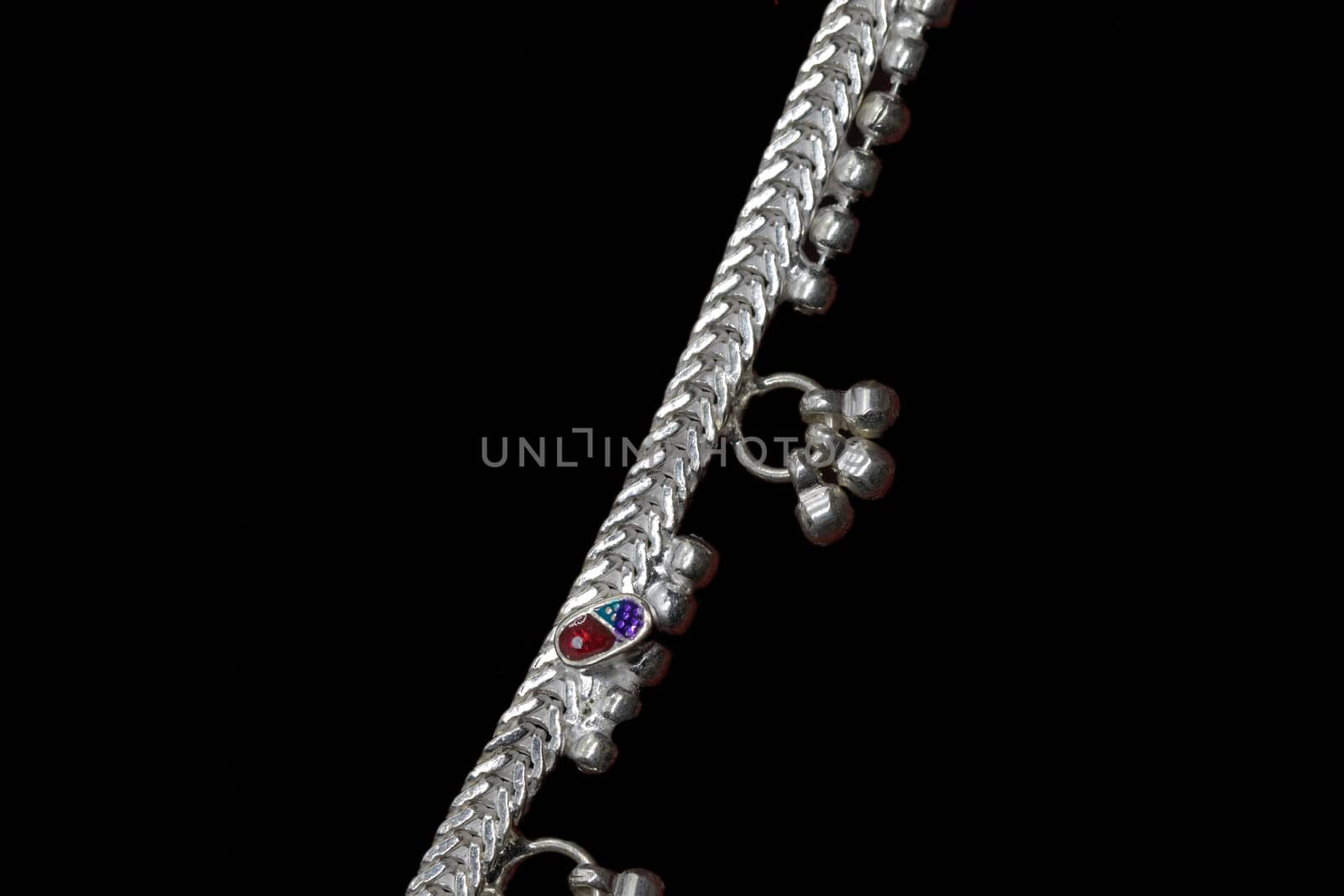 Beautiful catalogue design book of silver anklets on black background