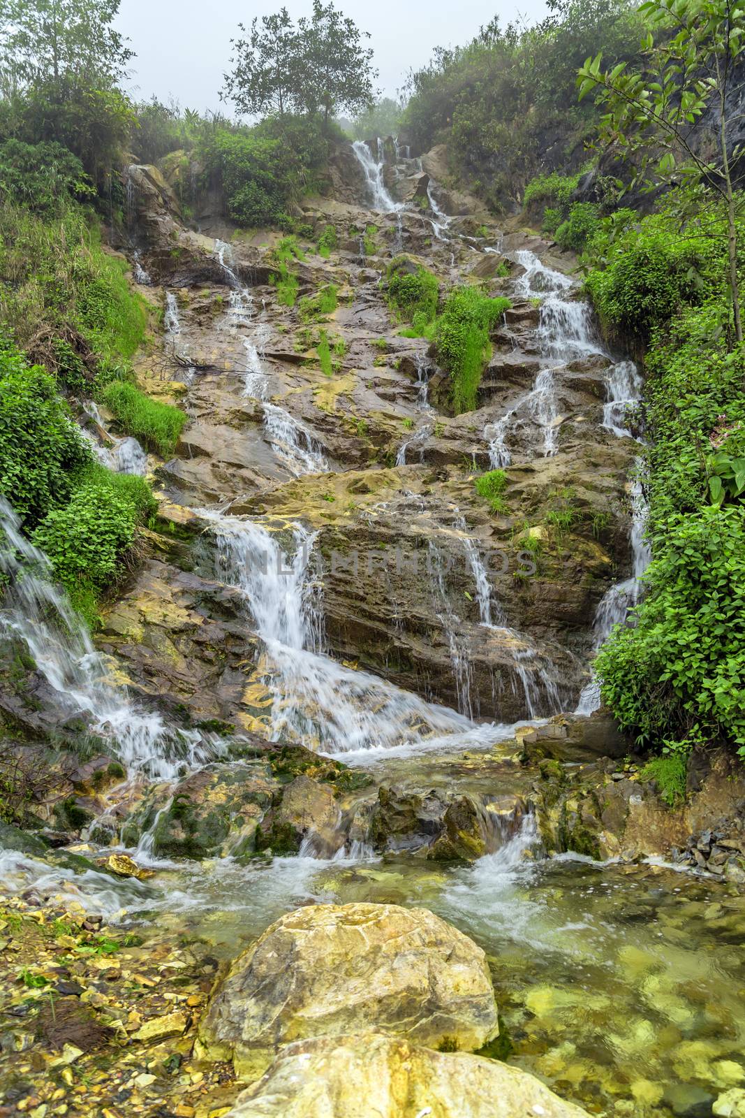 Landscape Waterfall cascade in jungle tropical rainforest