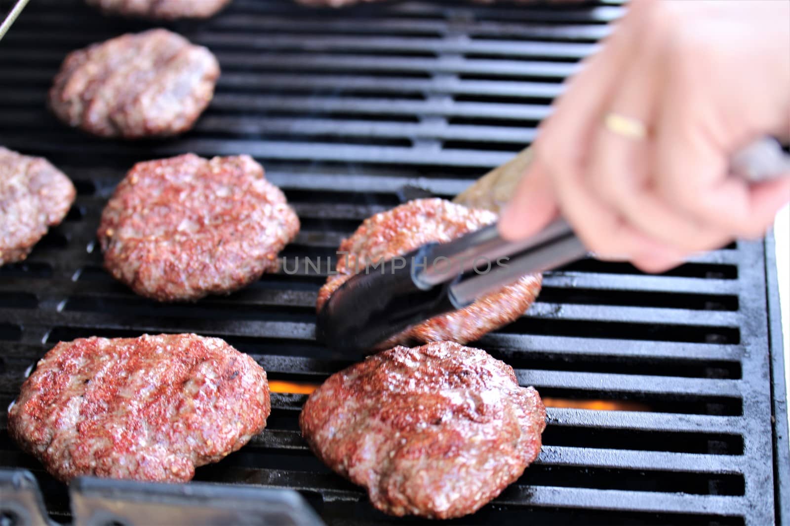 Several minced steaks on the grill