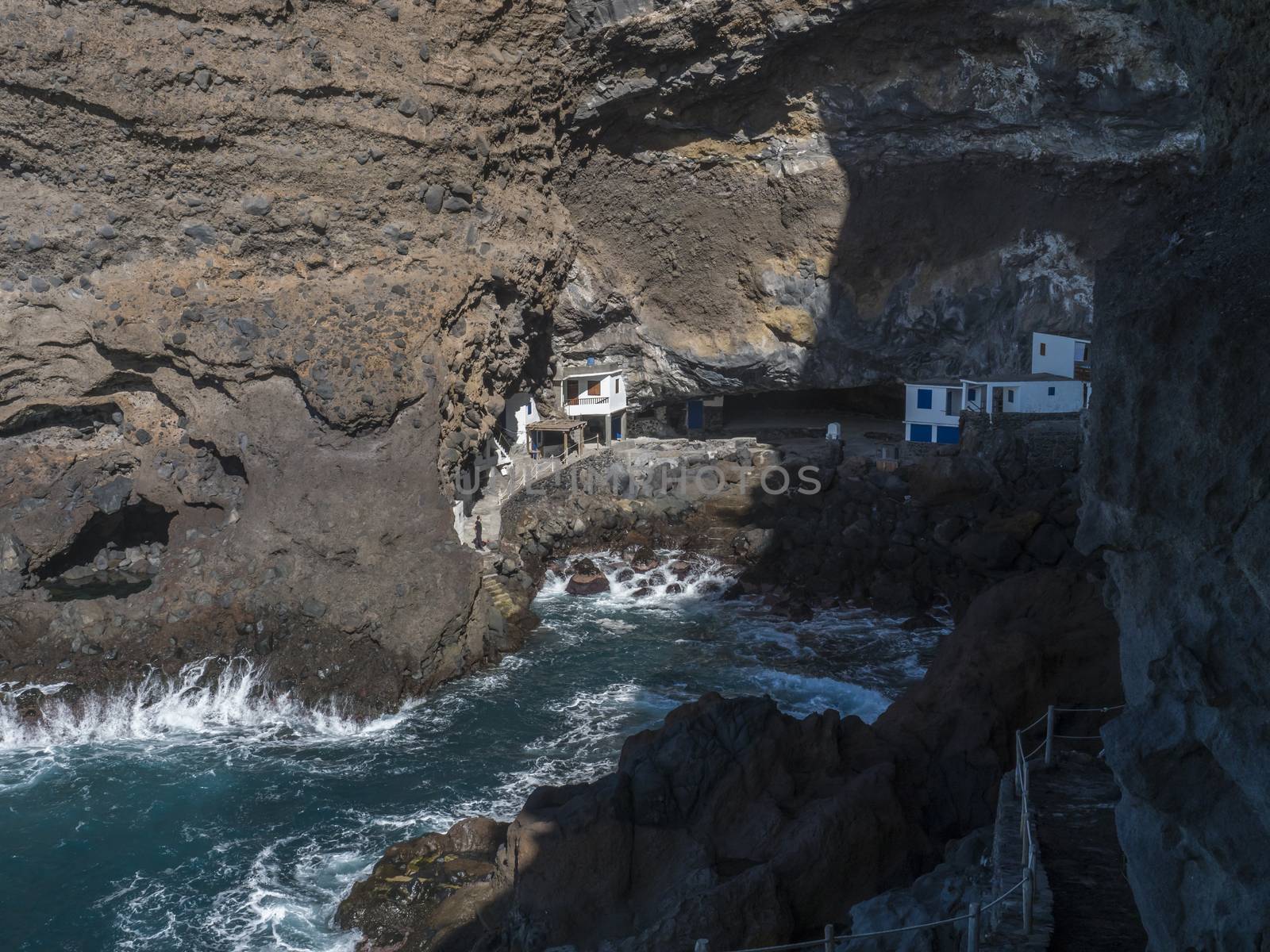 Cueva de Candelaria, Pirate cave Poris de Candelaria, small hidden fisherman village with white and blue houses, tourist attraction near Tijarafe, La Palma, Canary islands, Spain.